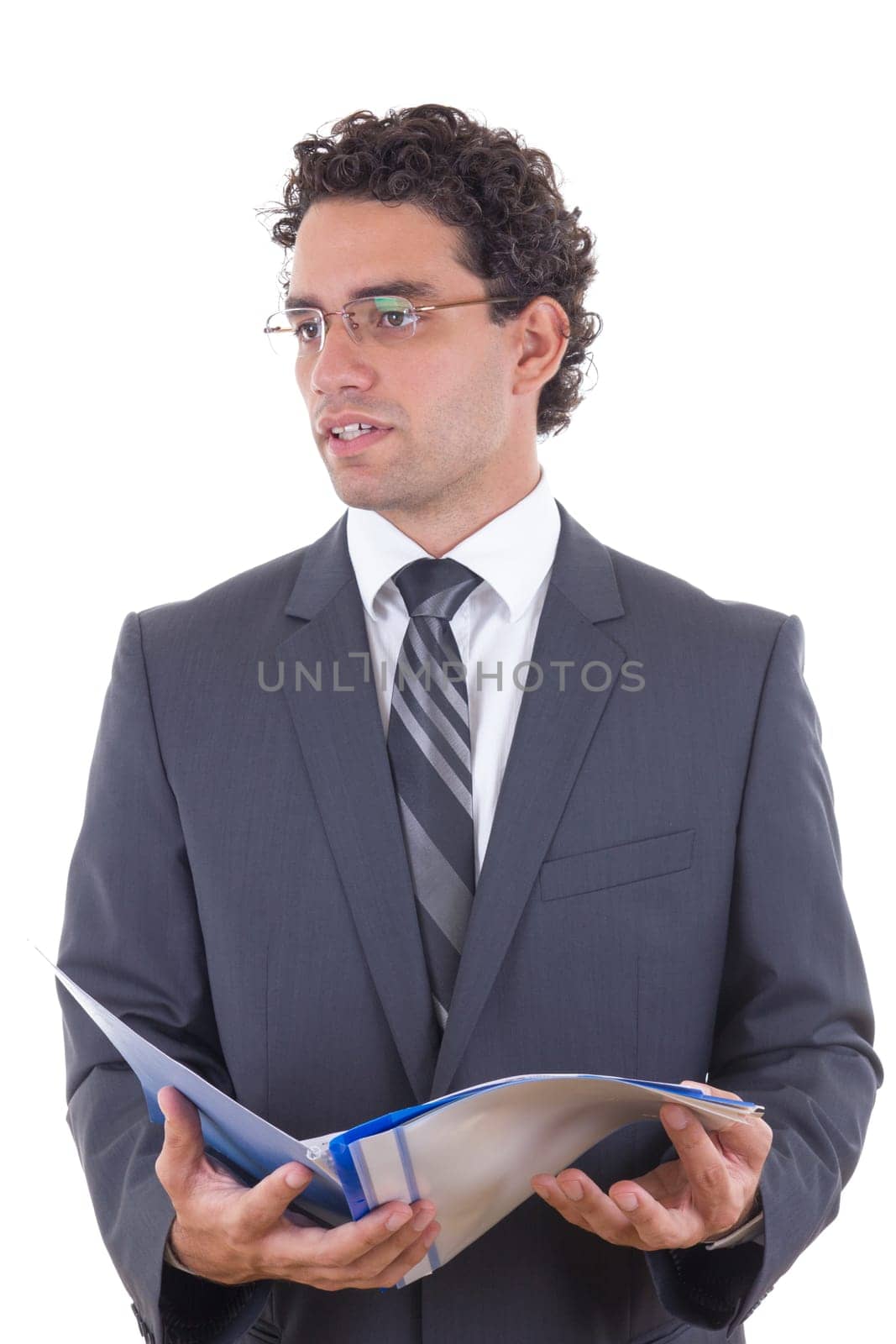 Young male businessman holding an open notebook