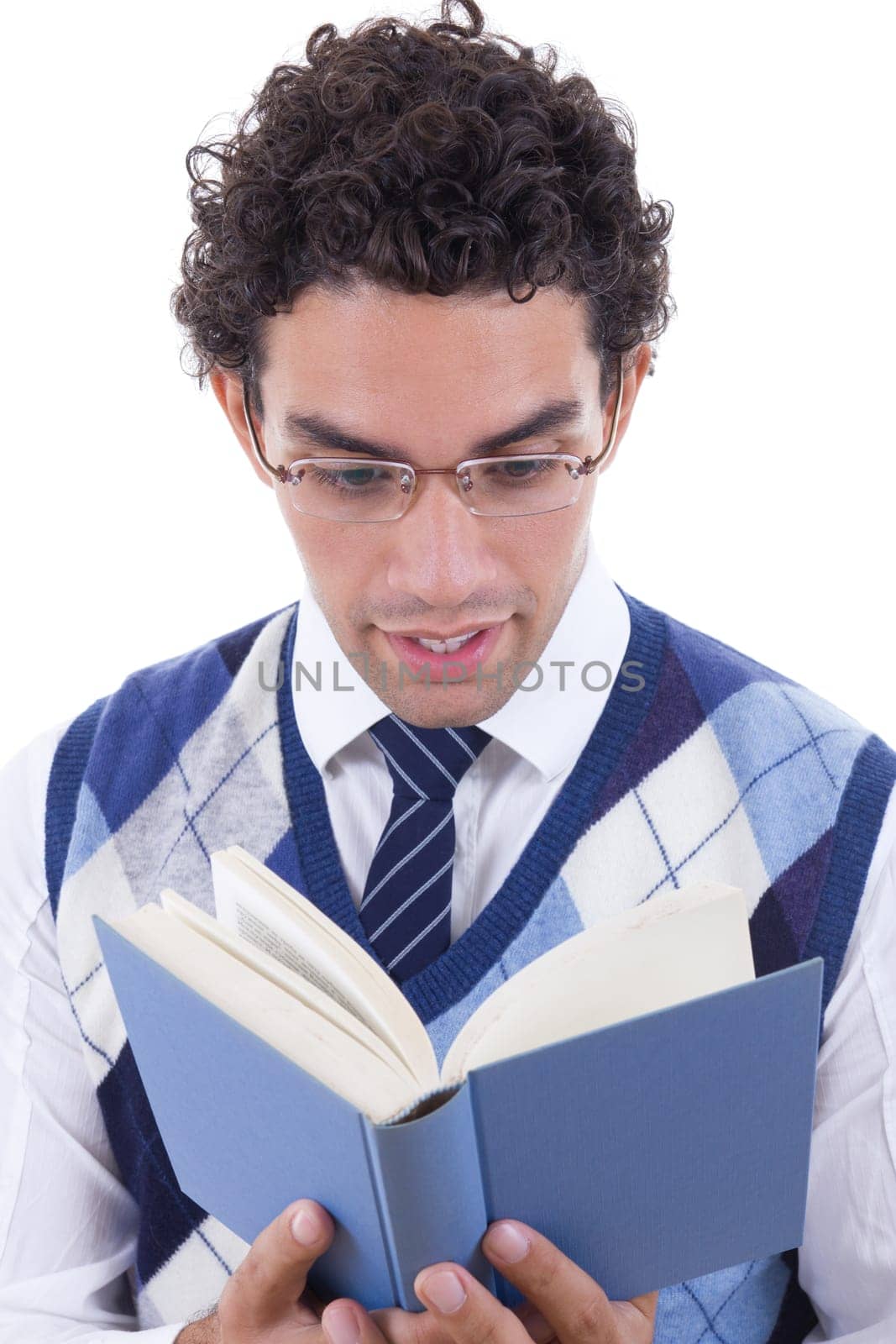 man with glasses and vest carefully reads the book