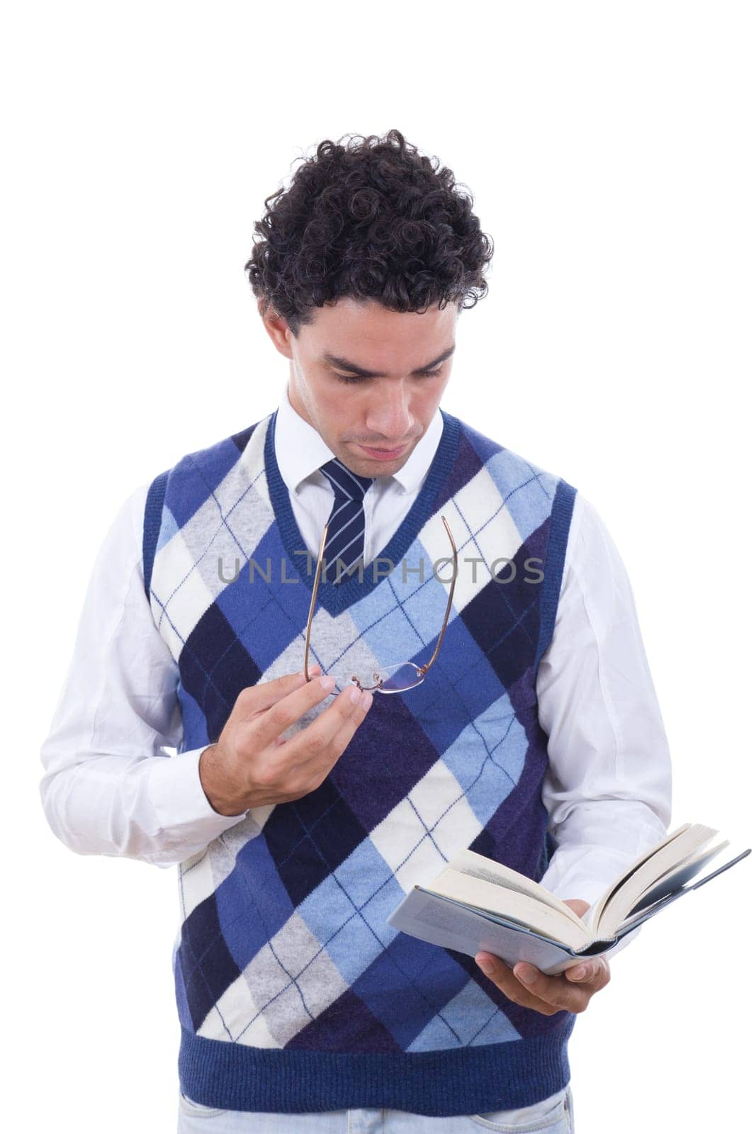 man holding glasses and reading a book