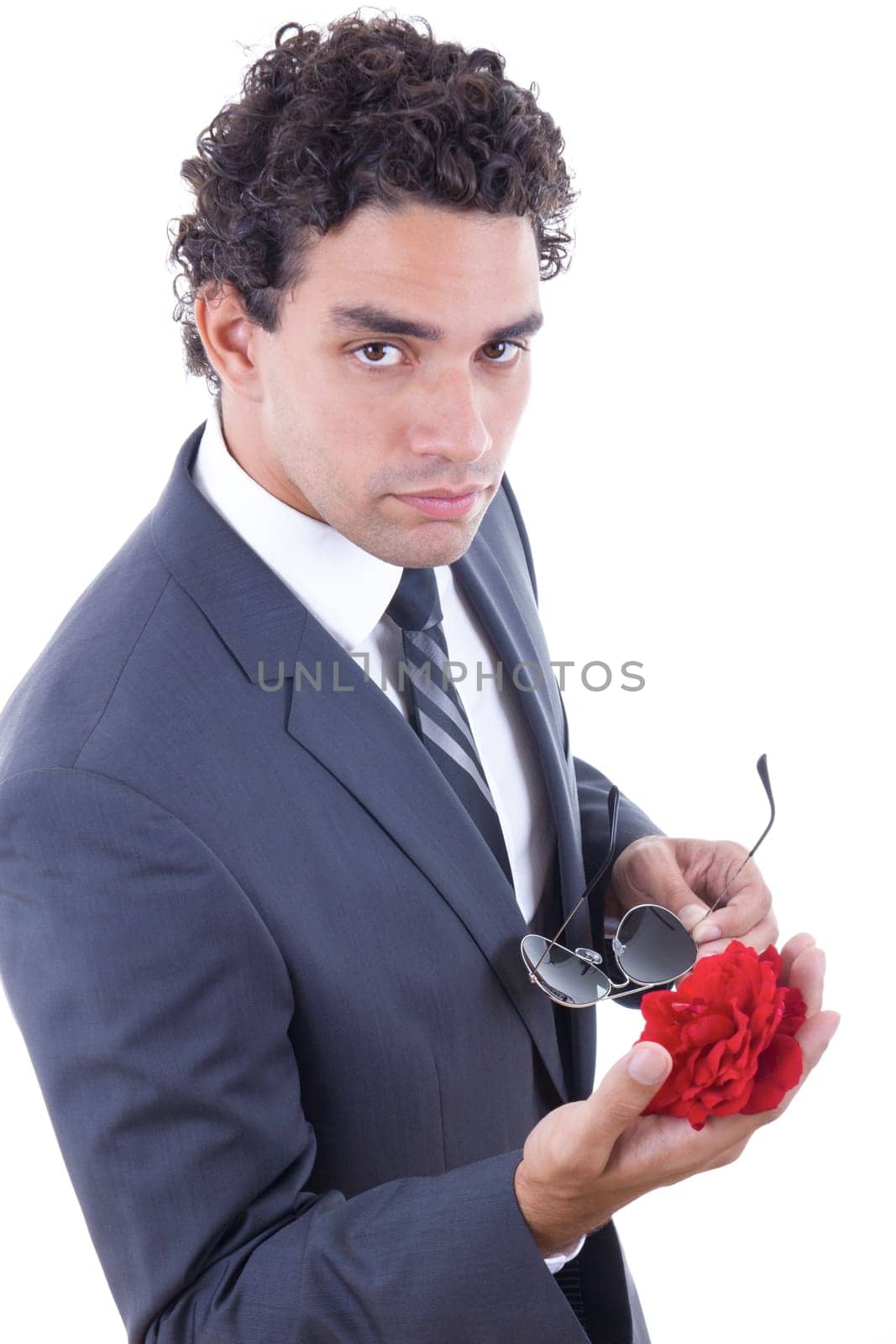 seducer in suit with sunglasess holding rose