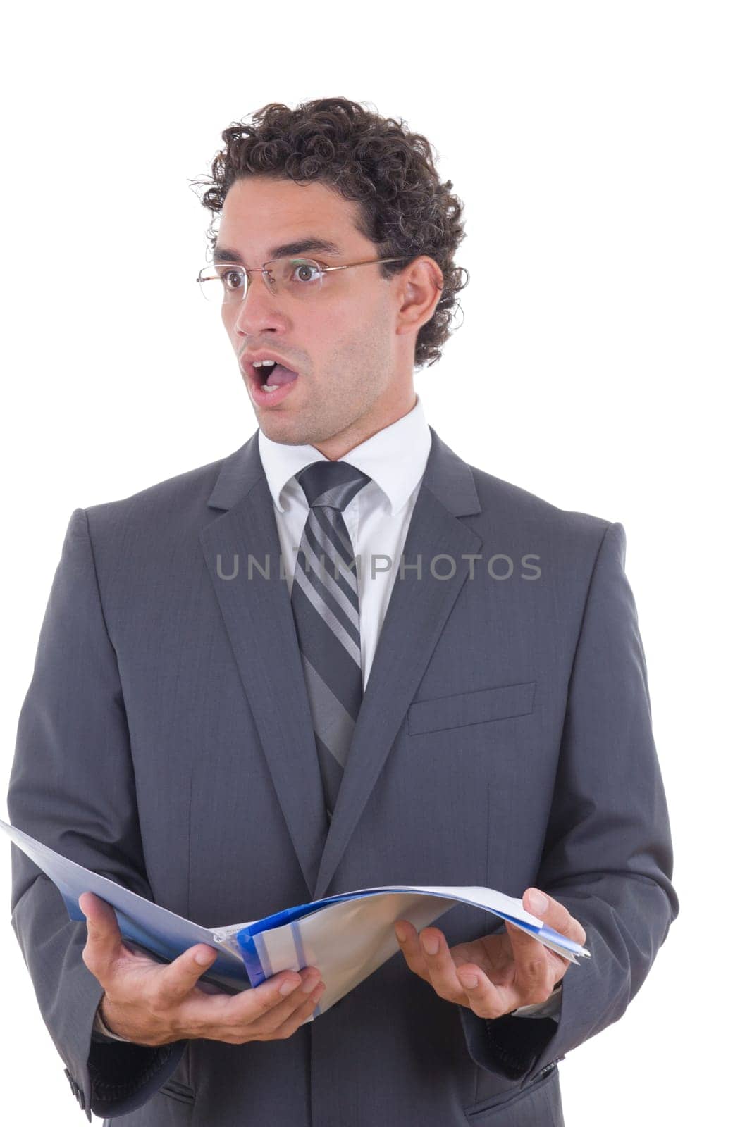 surprised young businessman holding an open notebook