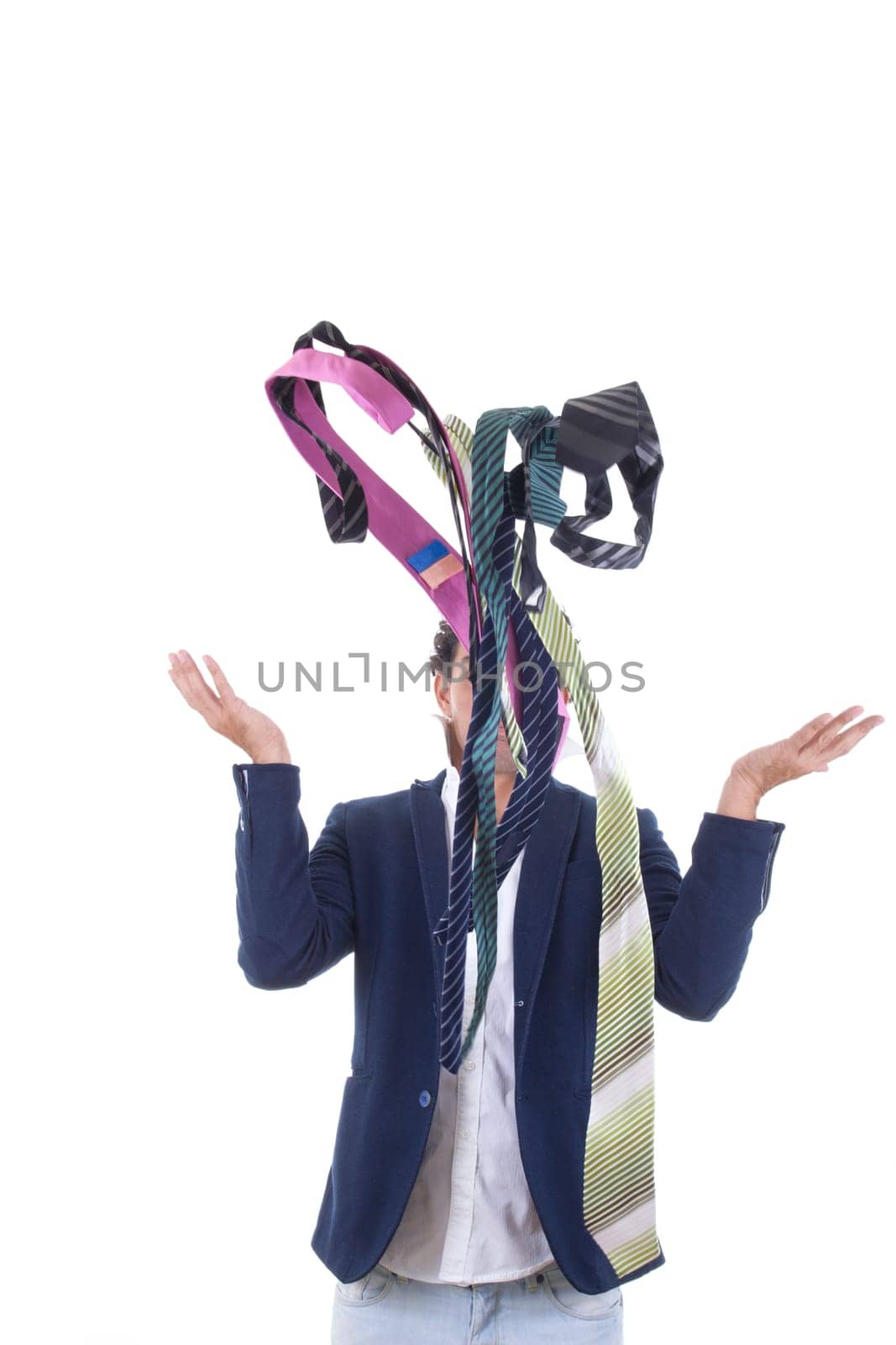 undecided man in suit with lot of ties all around him