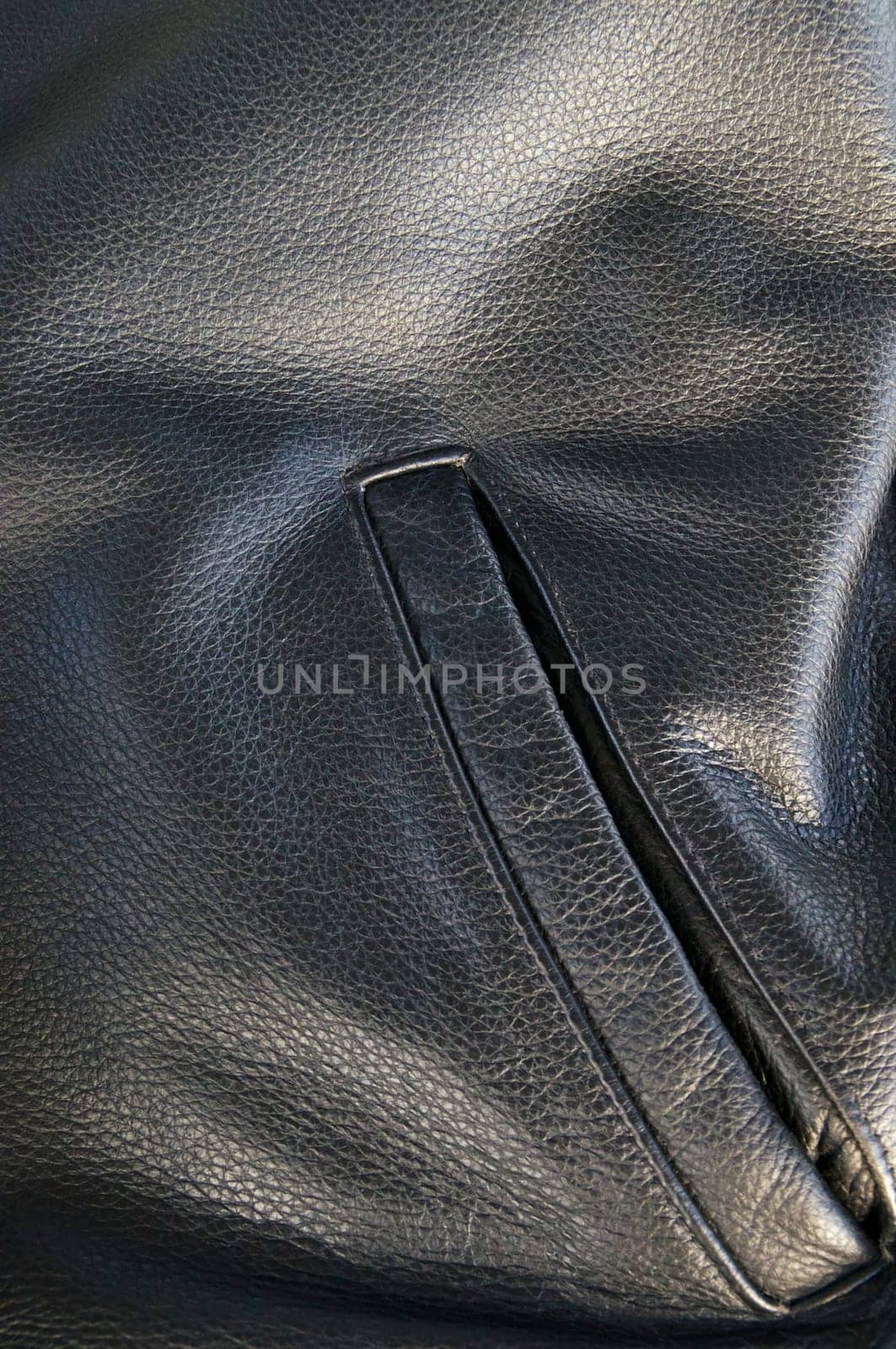 close up of side pocket of buffalo hide motorcycle jacket showing detail.