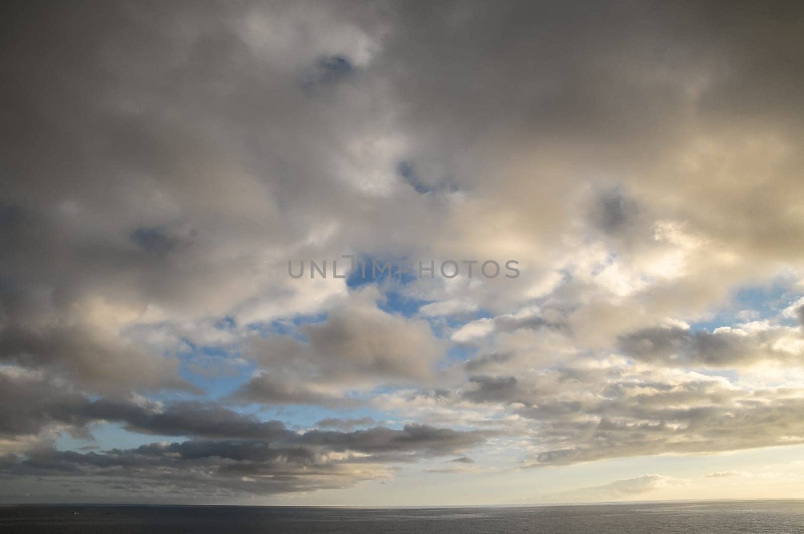 Cloudscape, Colored Clouds at Sunset near the Ocean