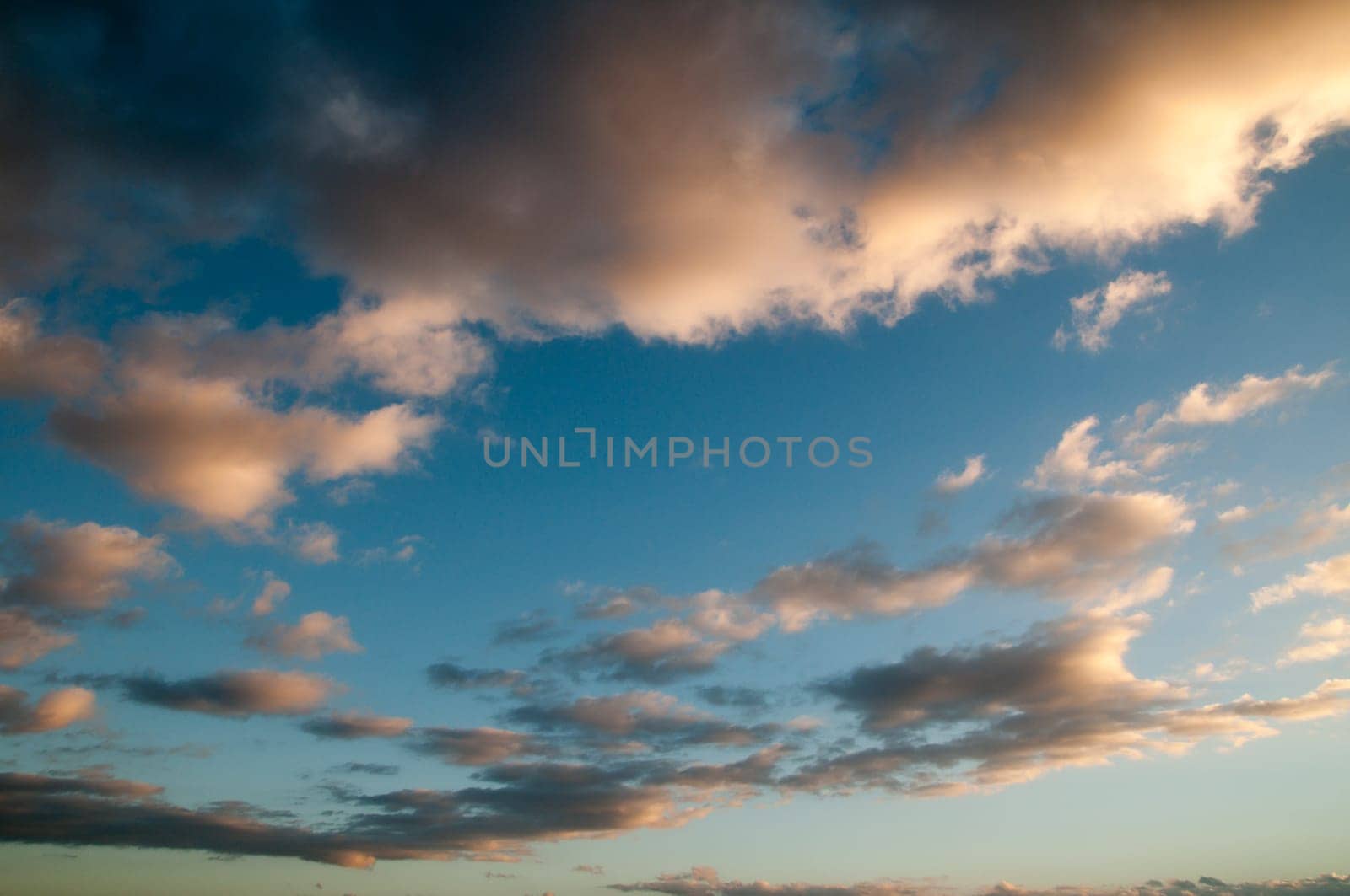 Cloudscape, Colored Clouds at Sunset near the Ocean