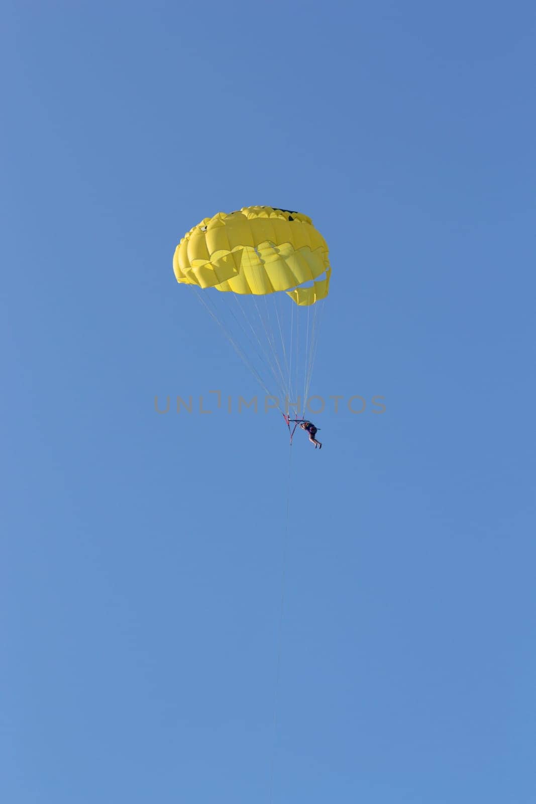 the skydiver flying in the open sky