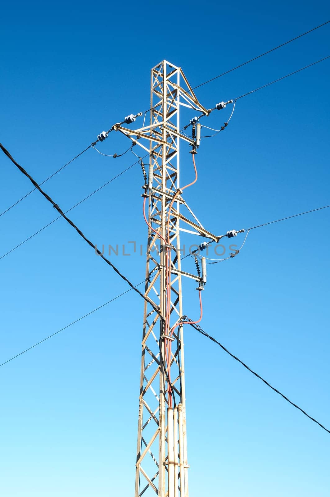 Energy Electricity Power Pylon on a Blue Sky