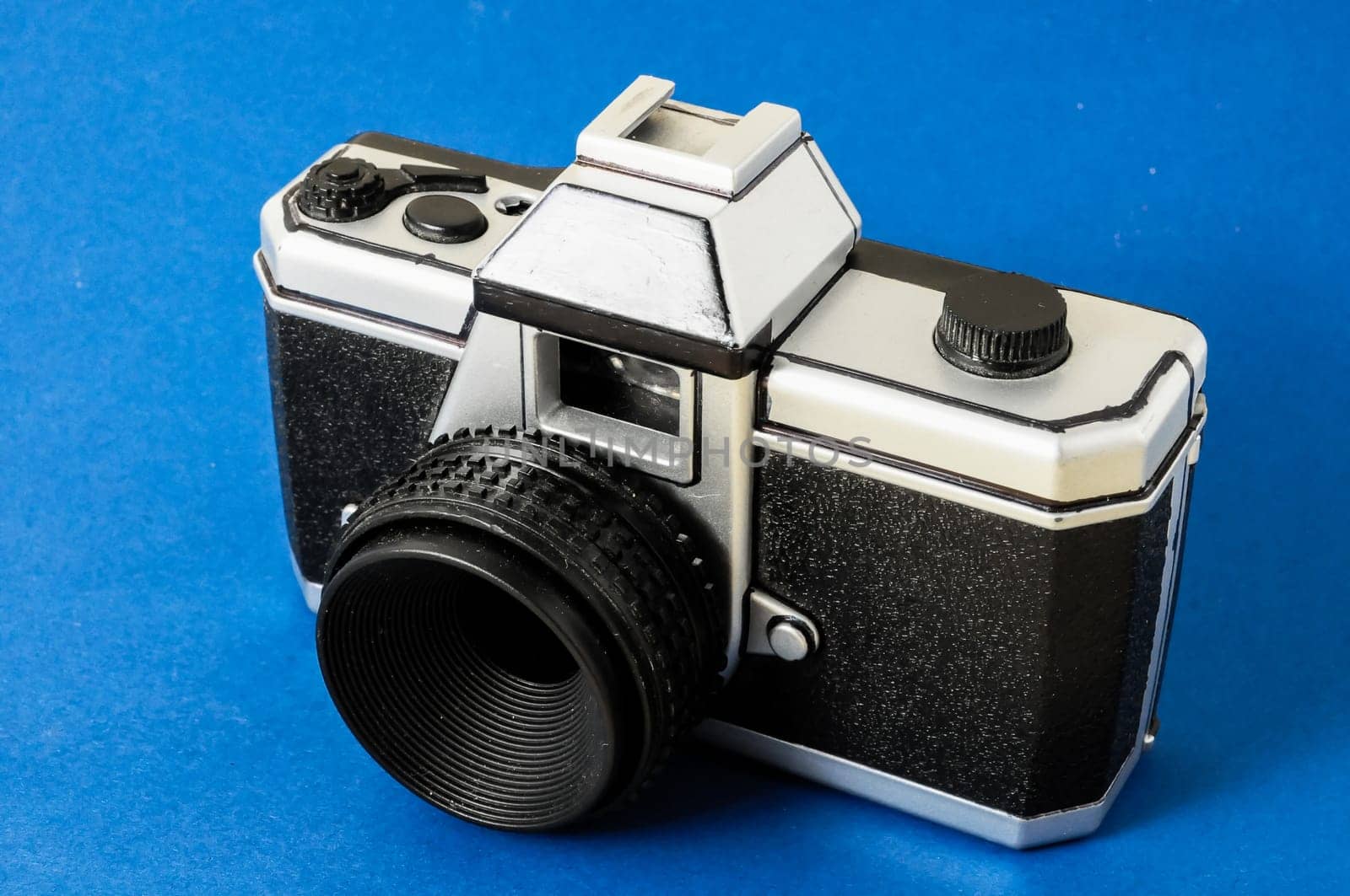 Classic 35mm Plastic Toy Photo Camera on a Colored Background