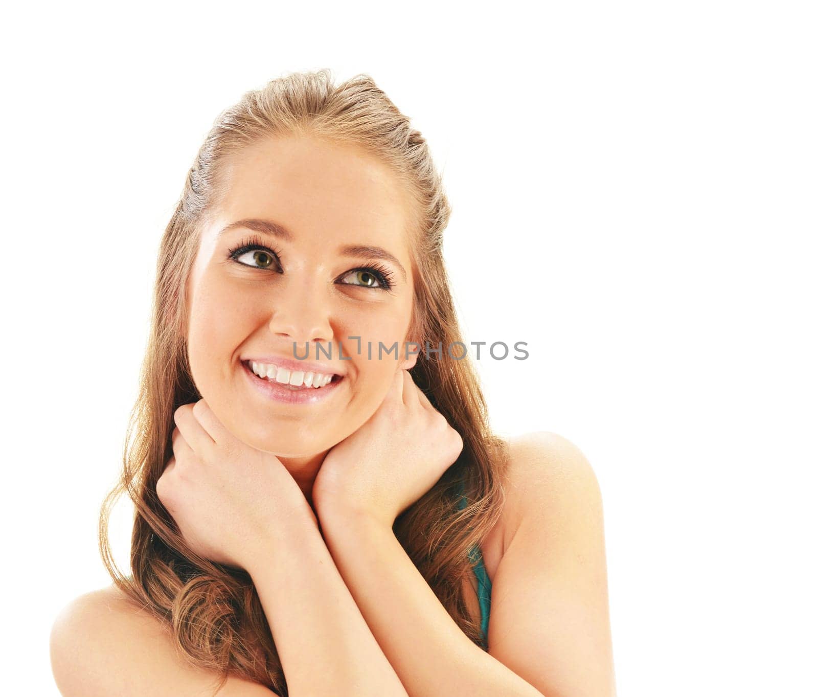 Portrait of smiling young woman watching up isolated on white