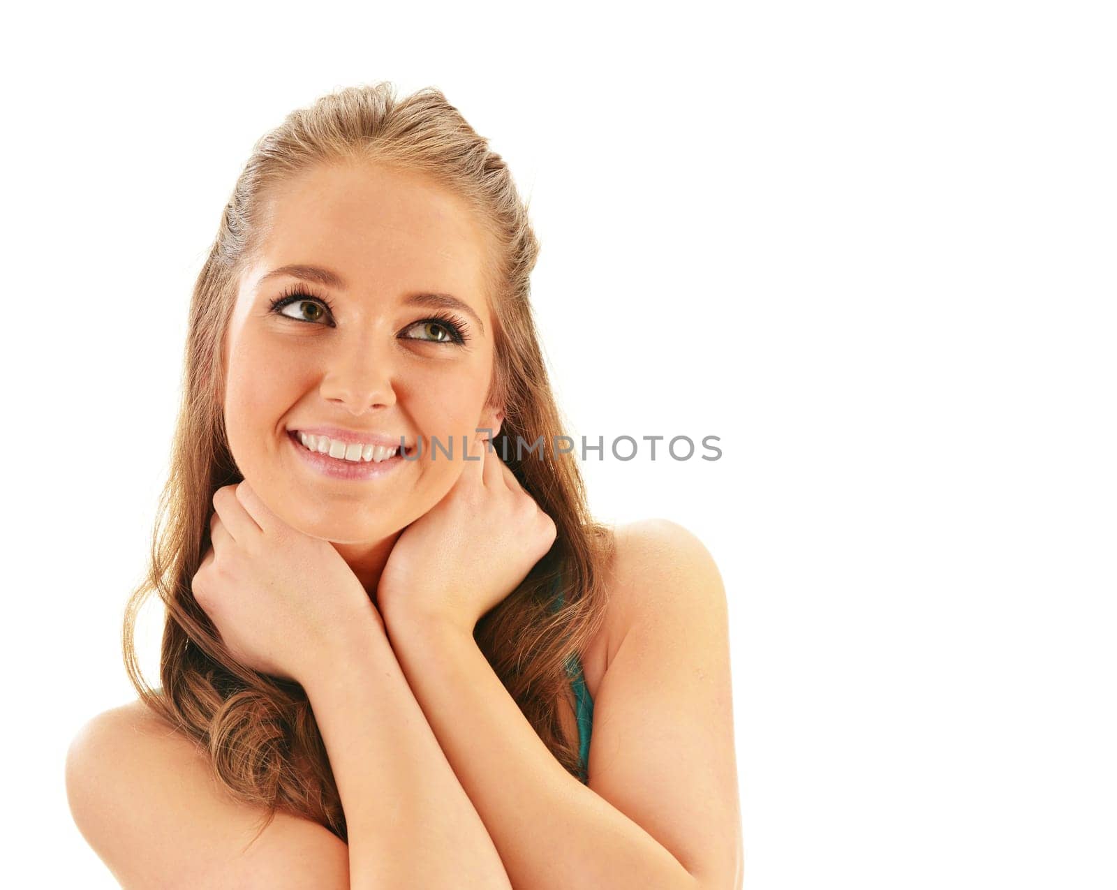 Portrait of smiling young woman watching up isolated on white