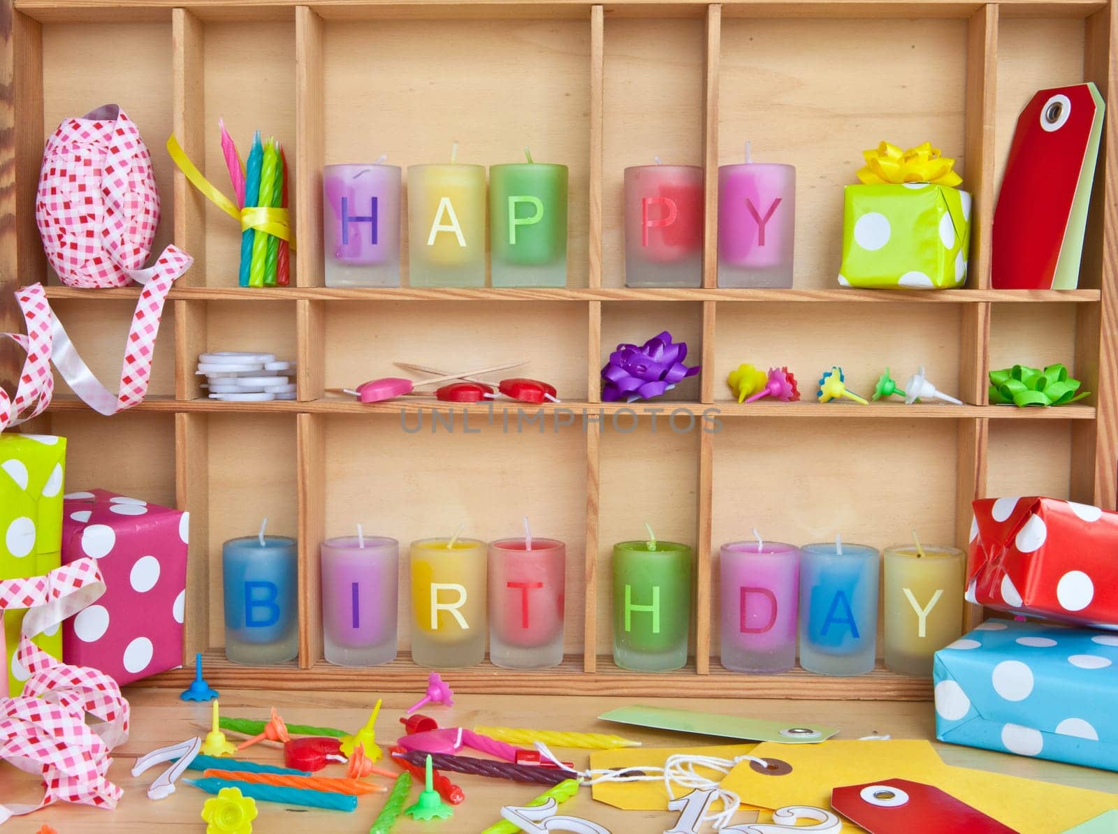 Happy Birthday written on colorful candles and gifts