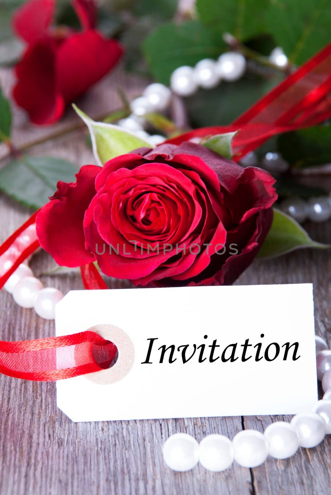Label with Invitation and Roses as Background