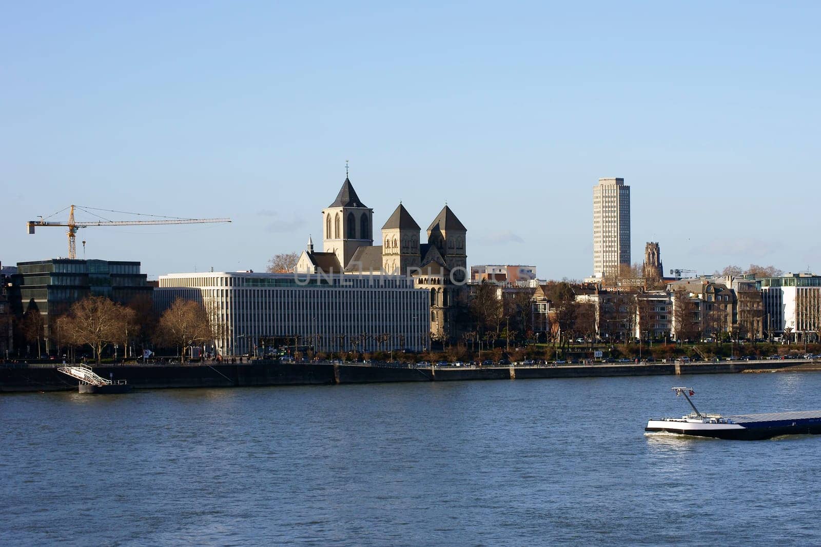 The skyline of Cologne with the Sankt Kunibert Church on the river Rhine.