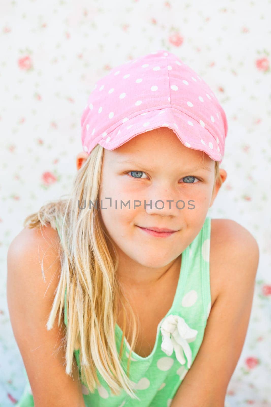 Portrait of cute happy young girl looking ahead