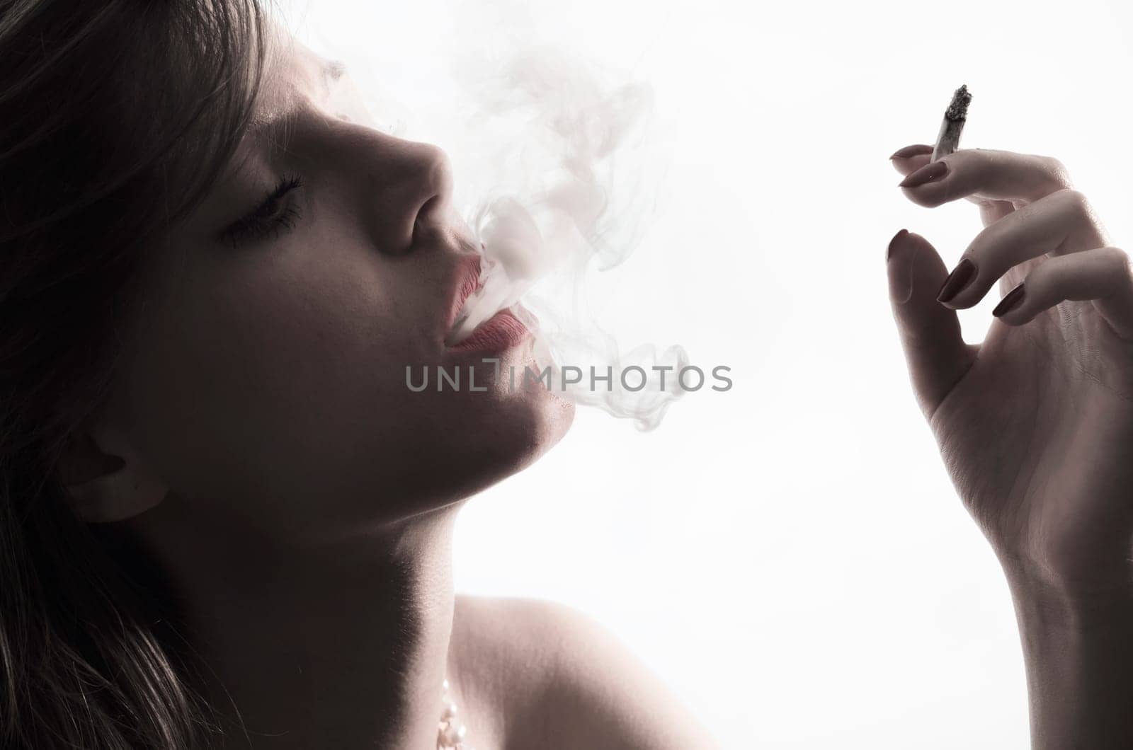 Portrait of young with cigarette