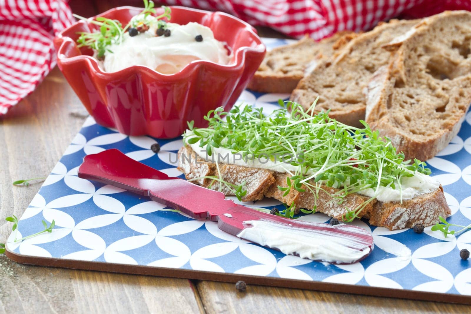 Fresh bread with fresh cheese and cress