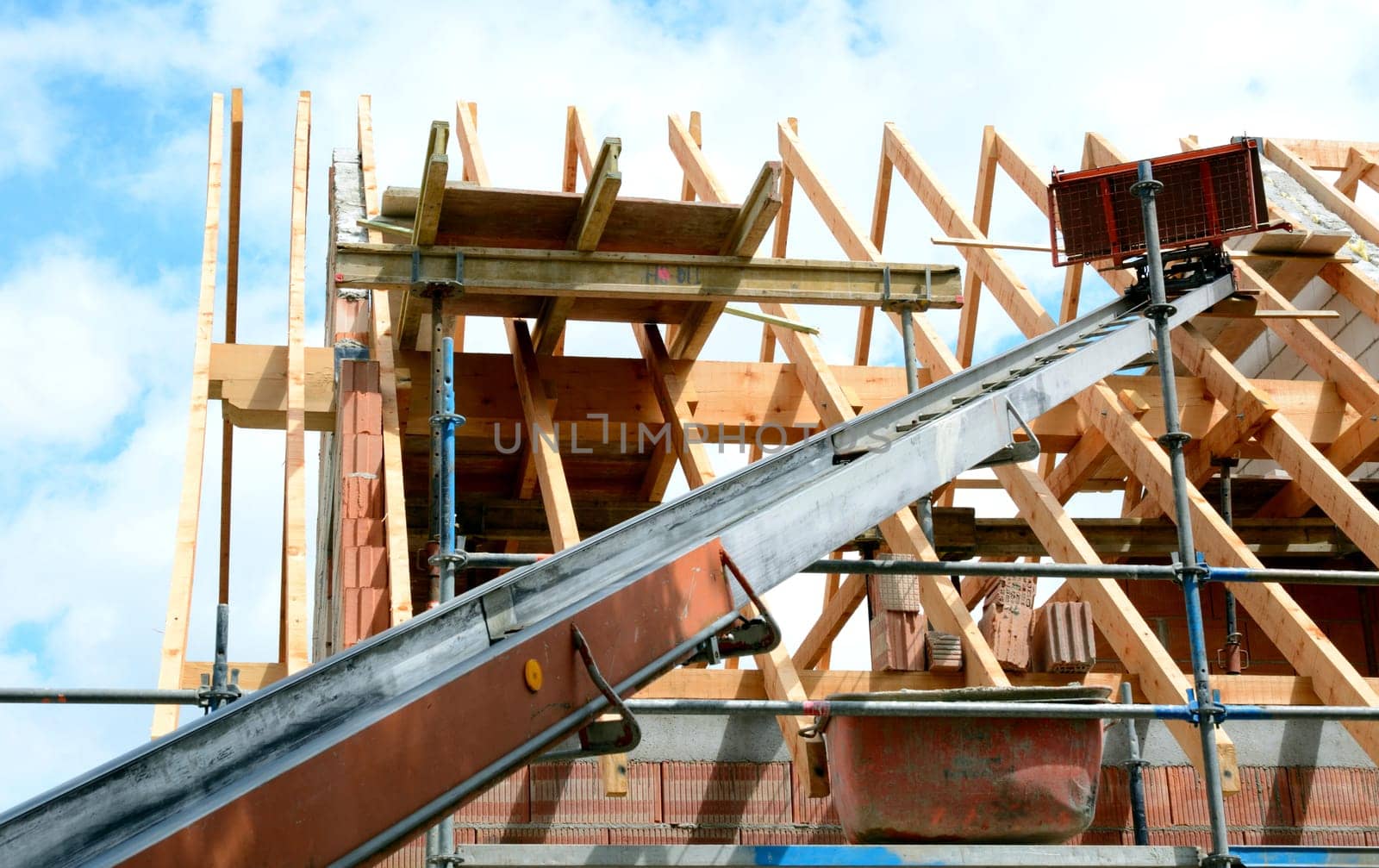 Roofing work with construction hoist