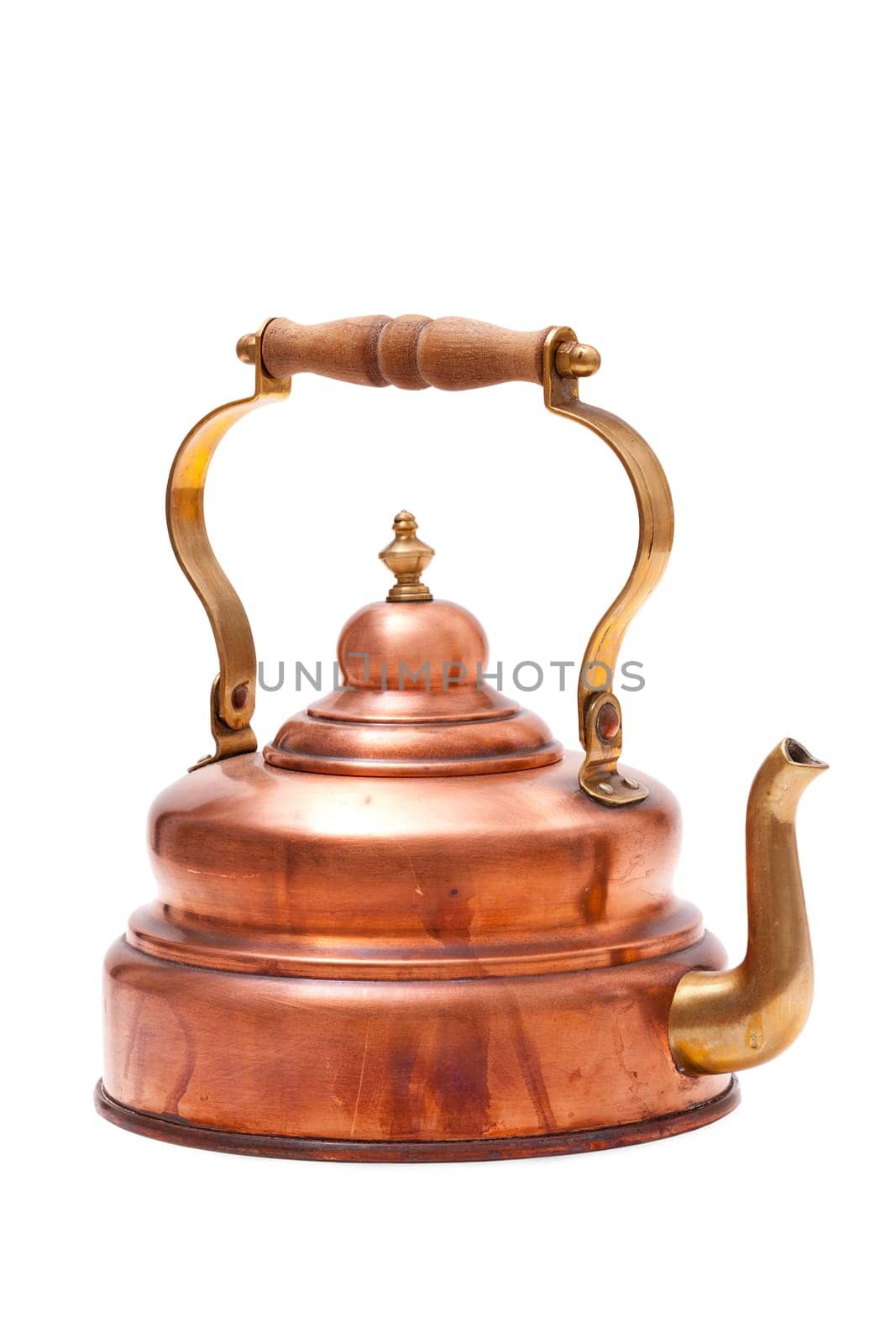 Old copper kettle insulated against a white background