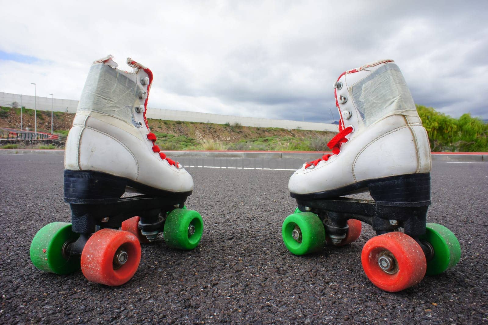 Old Vintage White Skate Boot on the Asphalt Sterret