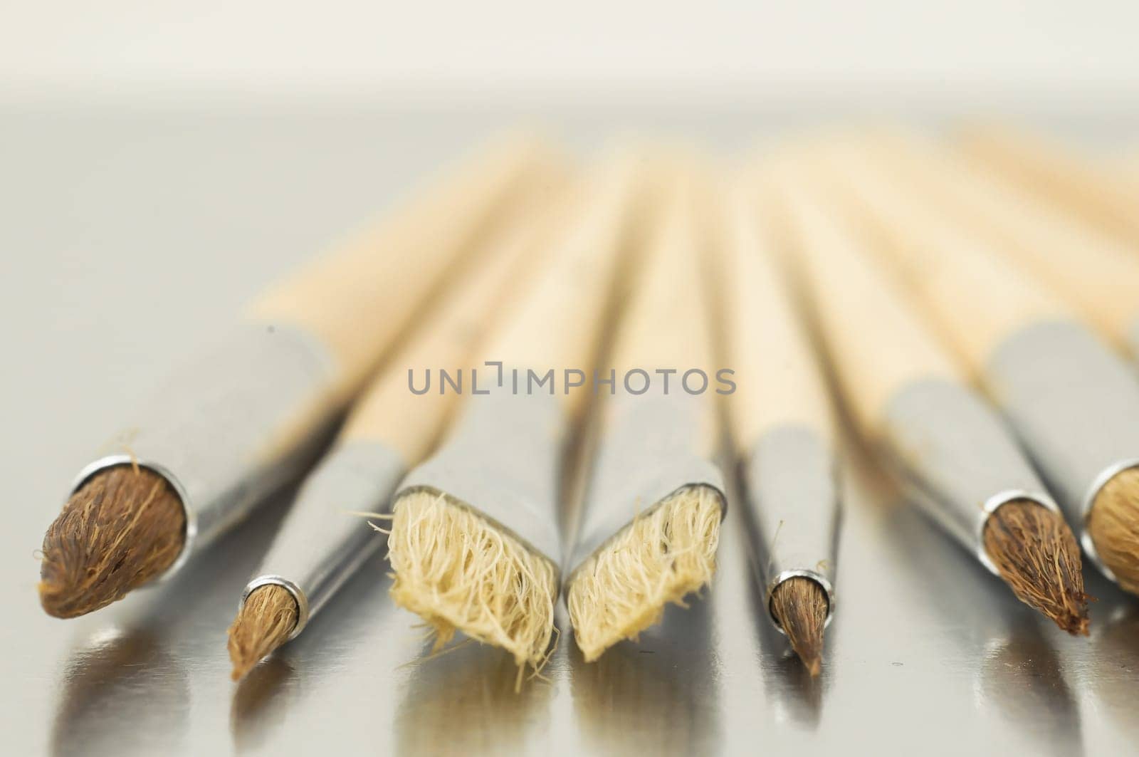 New Wooden Different Paintbrush Set Texture over a Colored Background