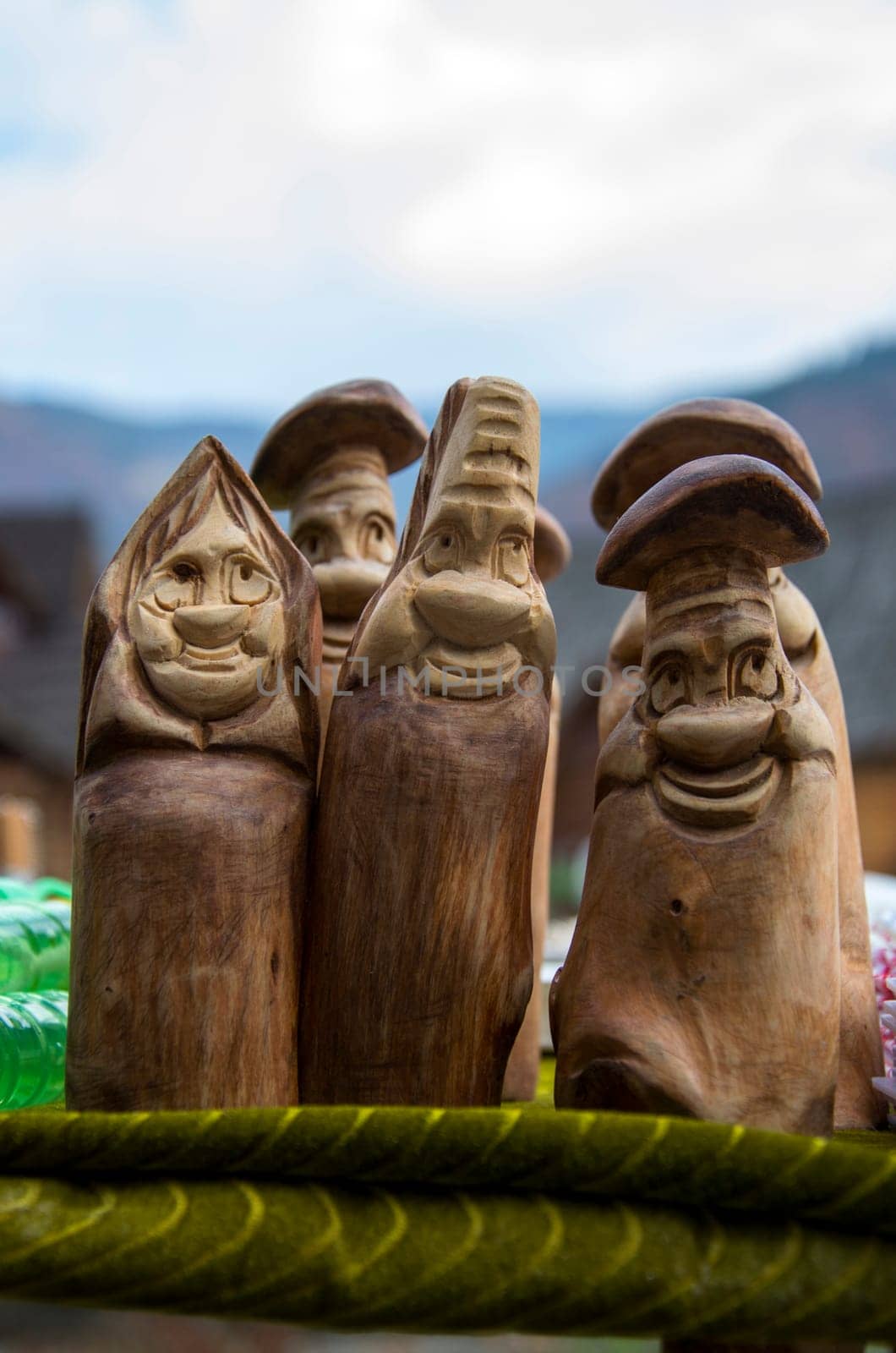 Wooden figures of gay people on green