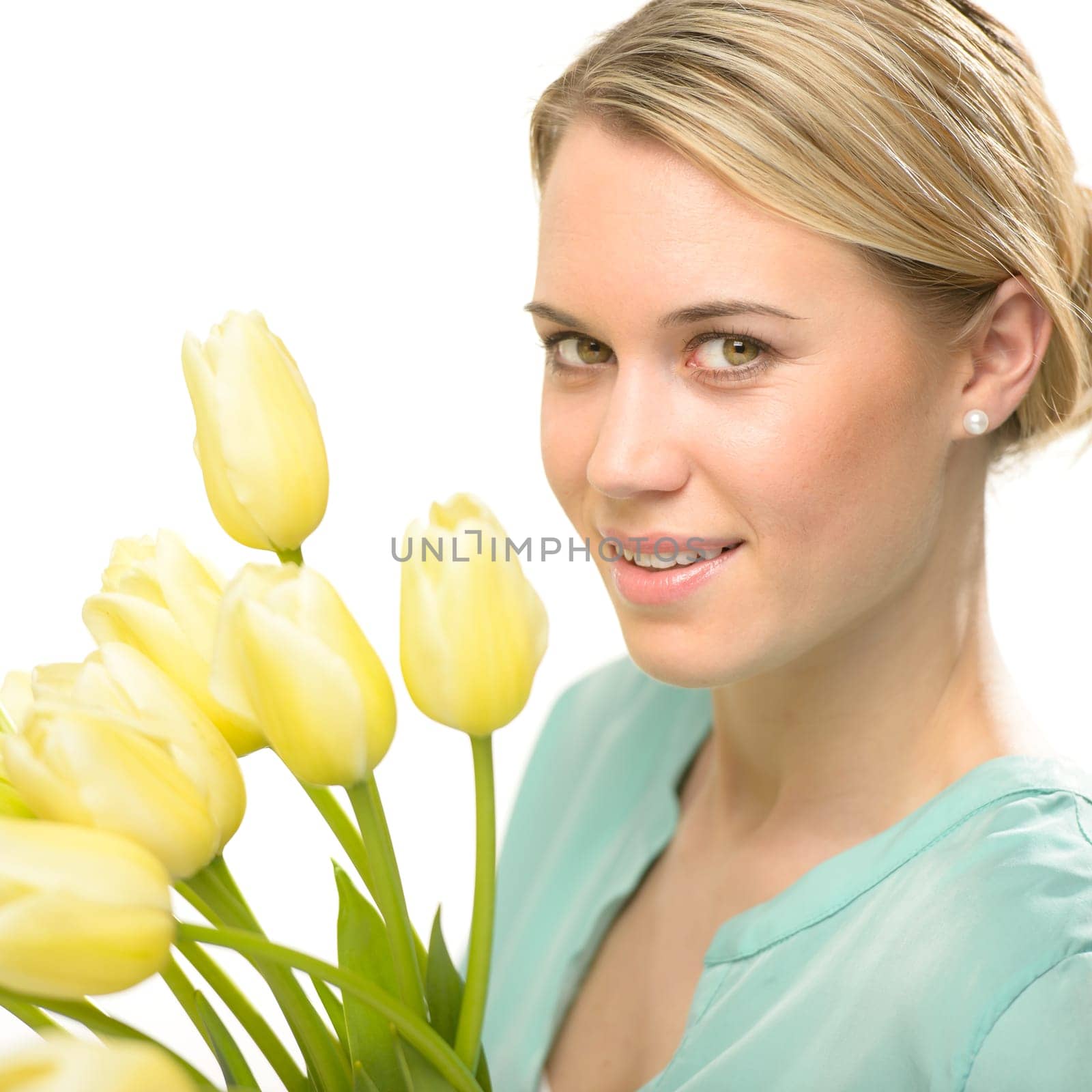Blond woman with yellow tulips spring flowers isolated