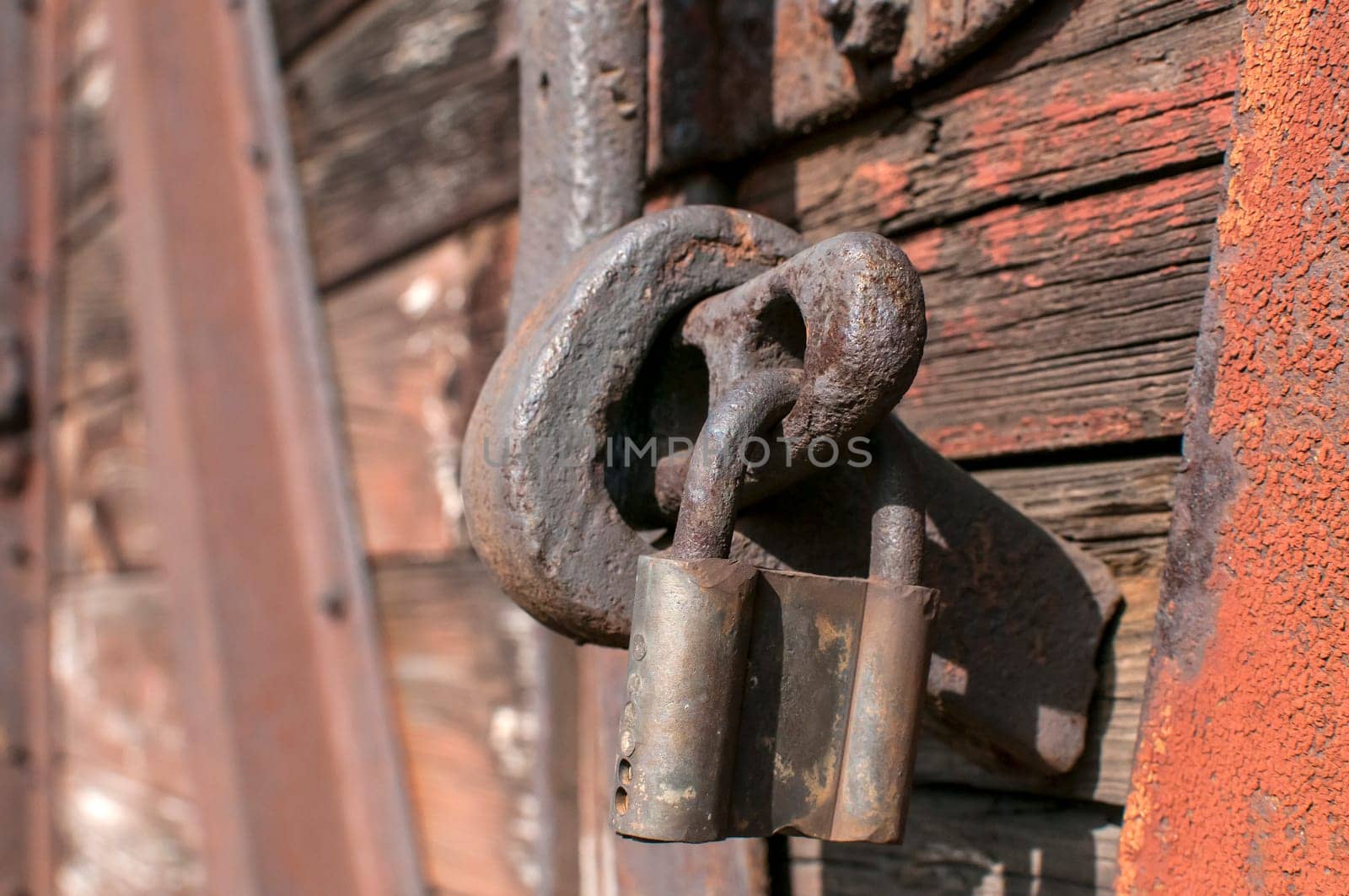 Old weathered latch and padlock on an vintage railway wagon