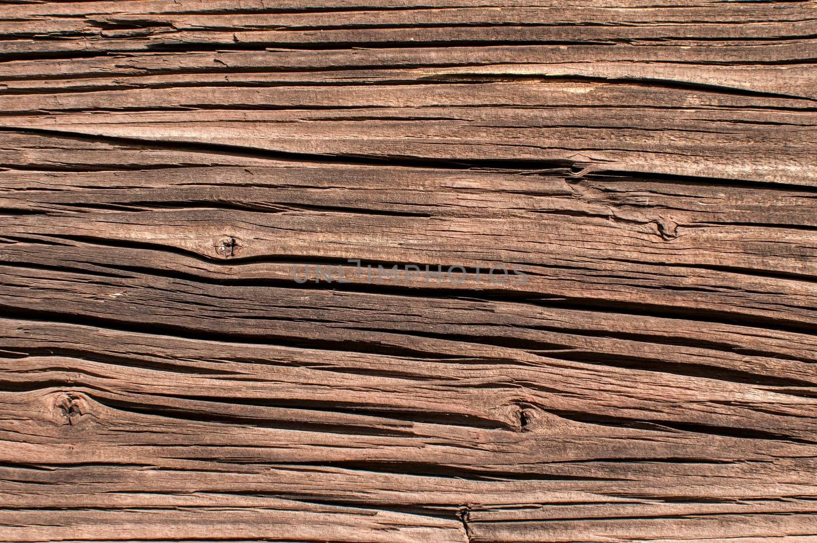 Old grunge weathered wooden railway wagon board closeup as background