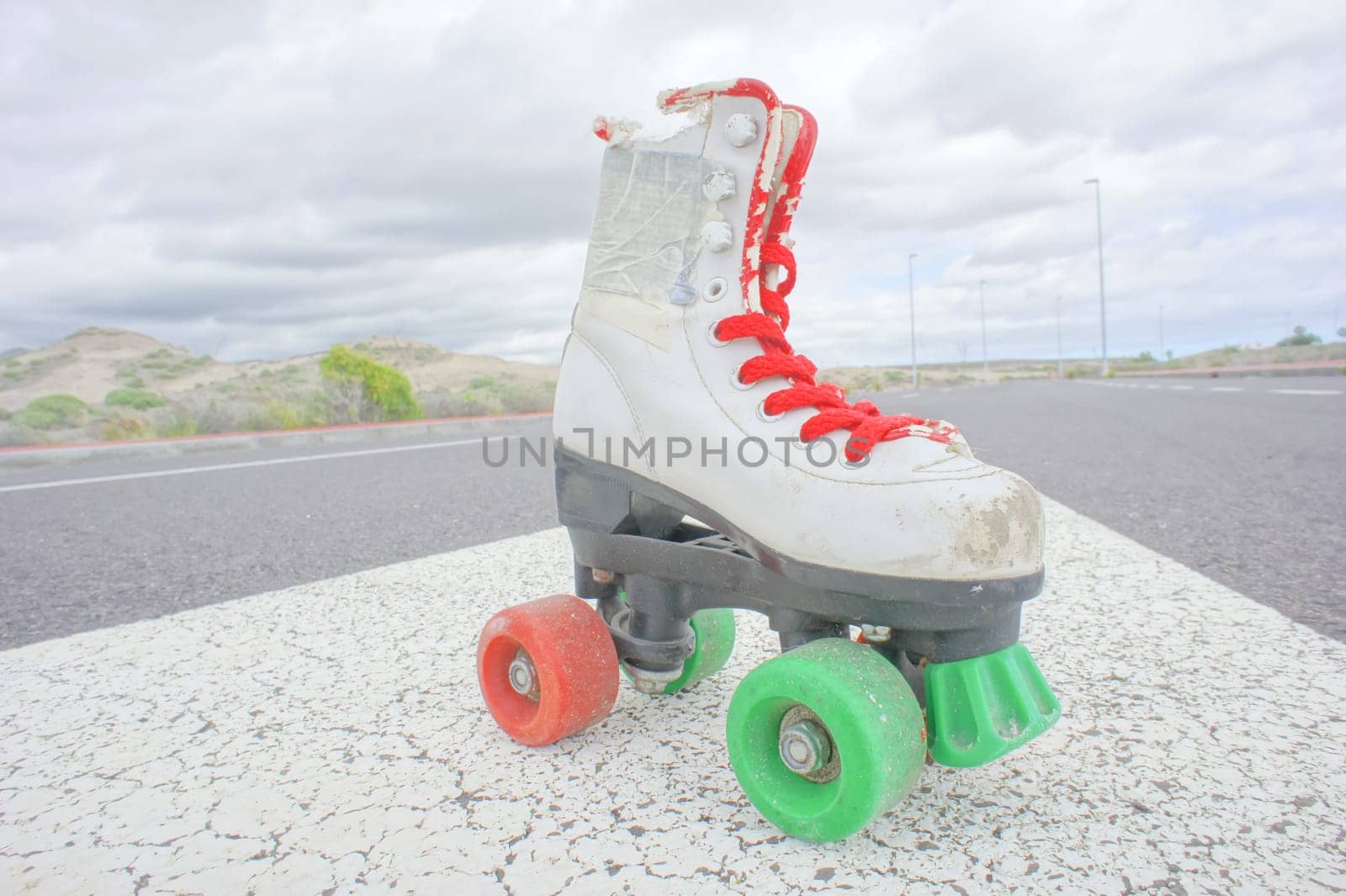 Hdr Picture of Old Vintage White Skate Boot on the Asphalt Sterret