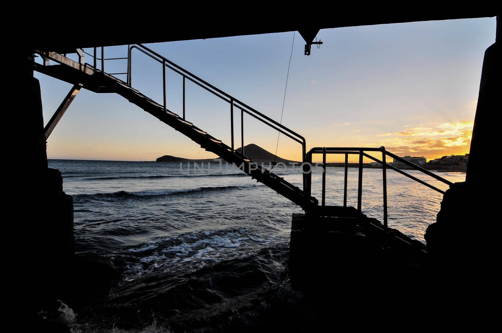 Sunset on the Atlantic Ocean with a Mountain in Background El Medano Tenerife Canary Islands Spain