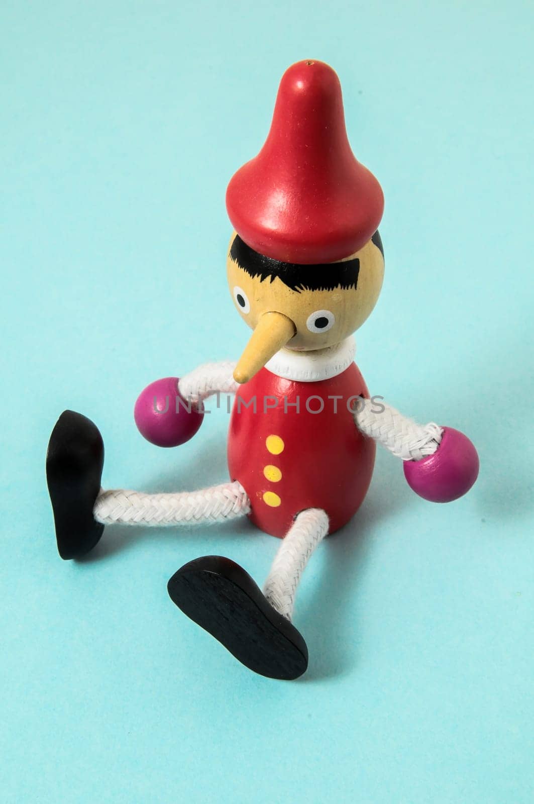 Pinocchio Toy Statue on a Colored Background