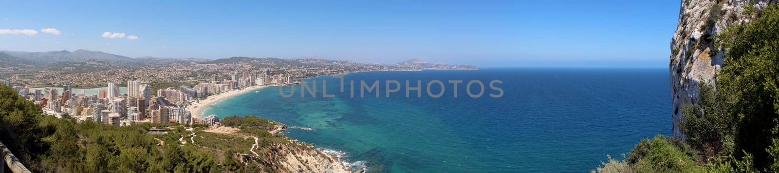 Panoramic view over Calp (Spain). Town bay beach