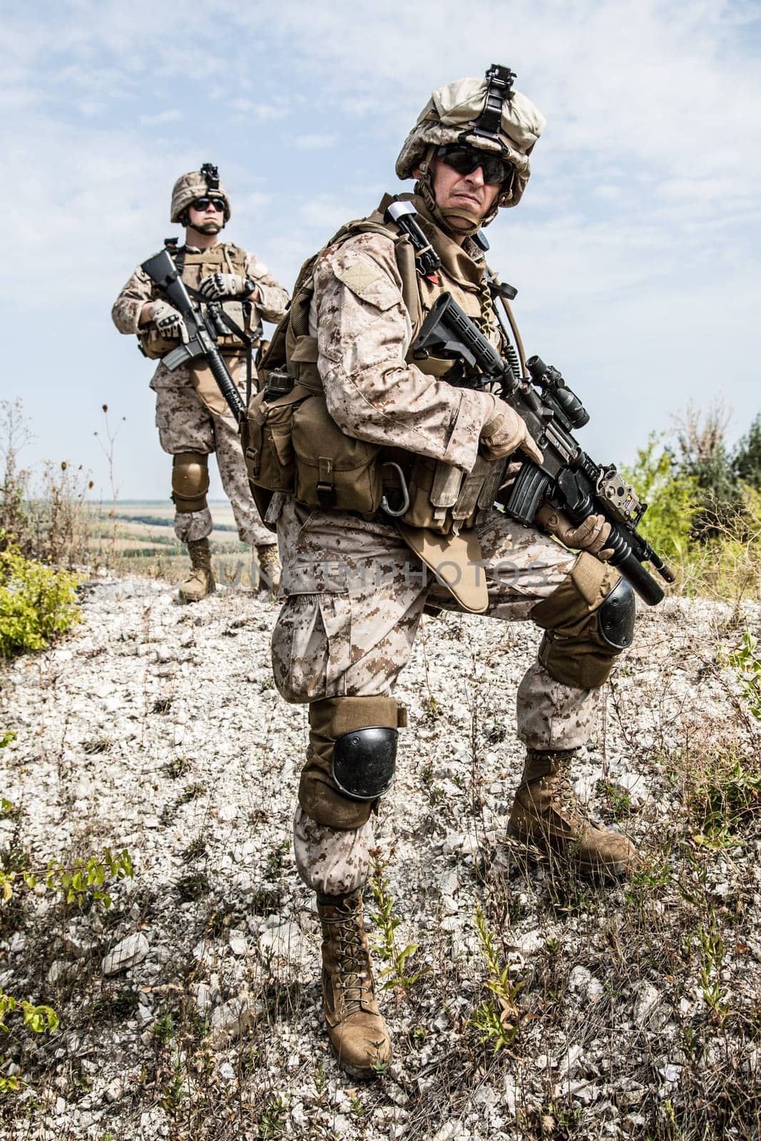 Two soldiers in the mountains during the military operation