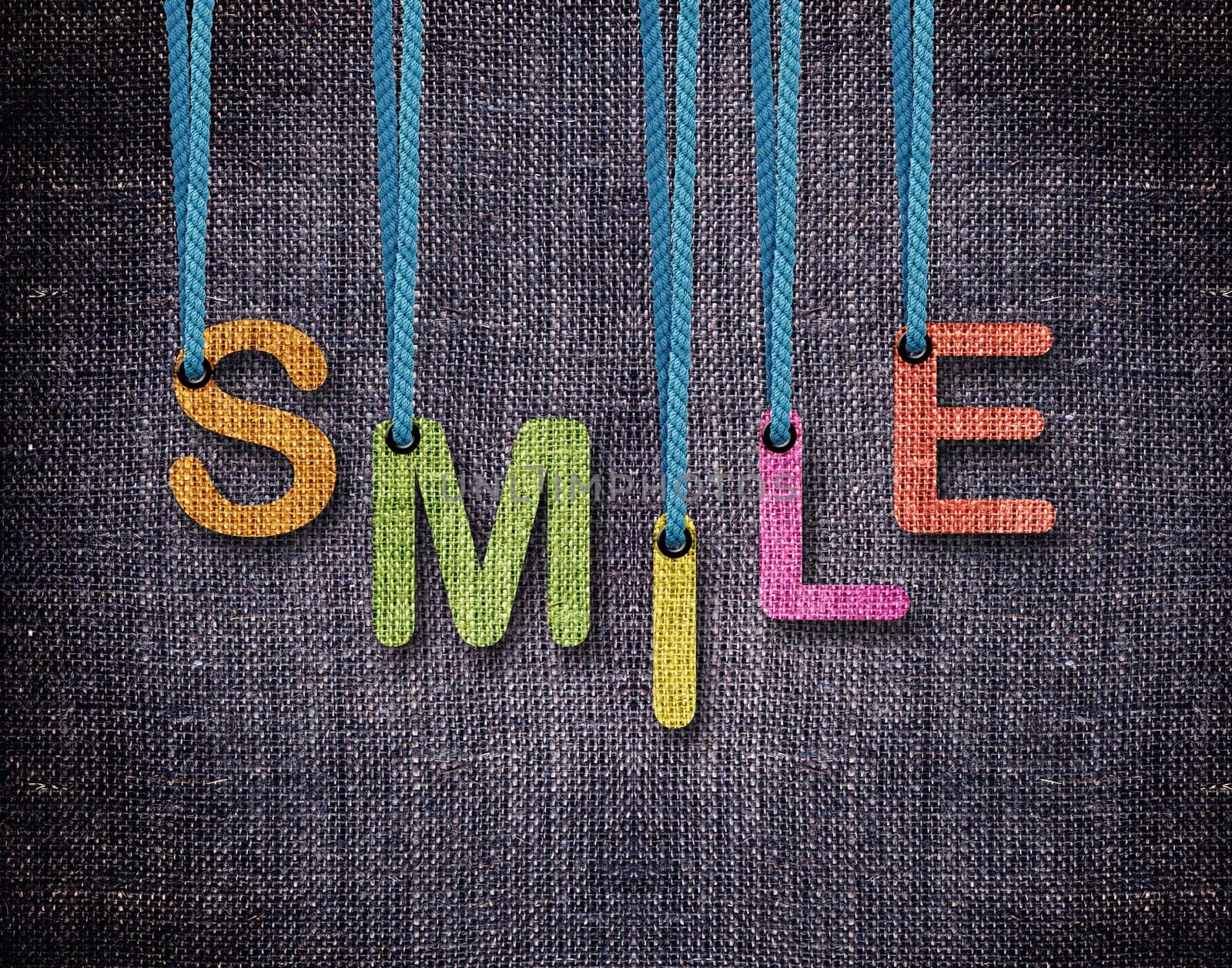 Smile Letters hanging strings with blue sackcloth background.