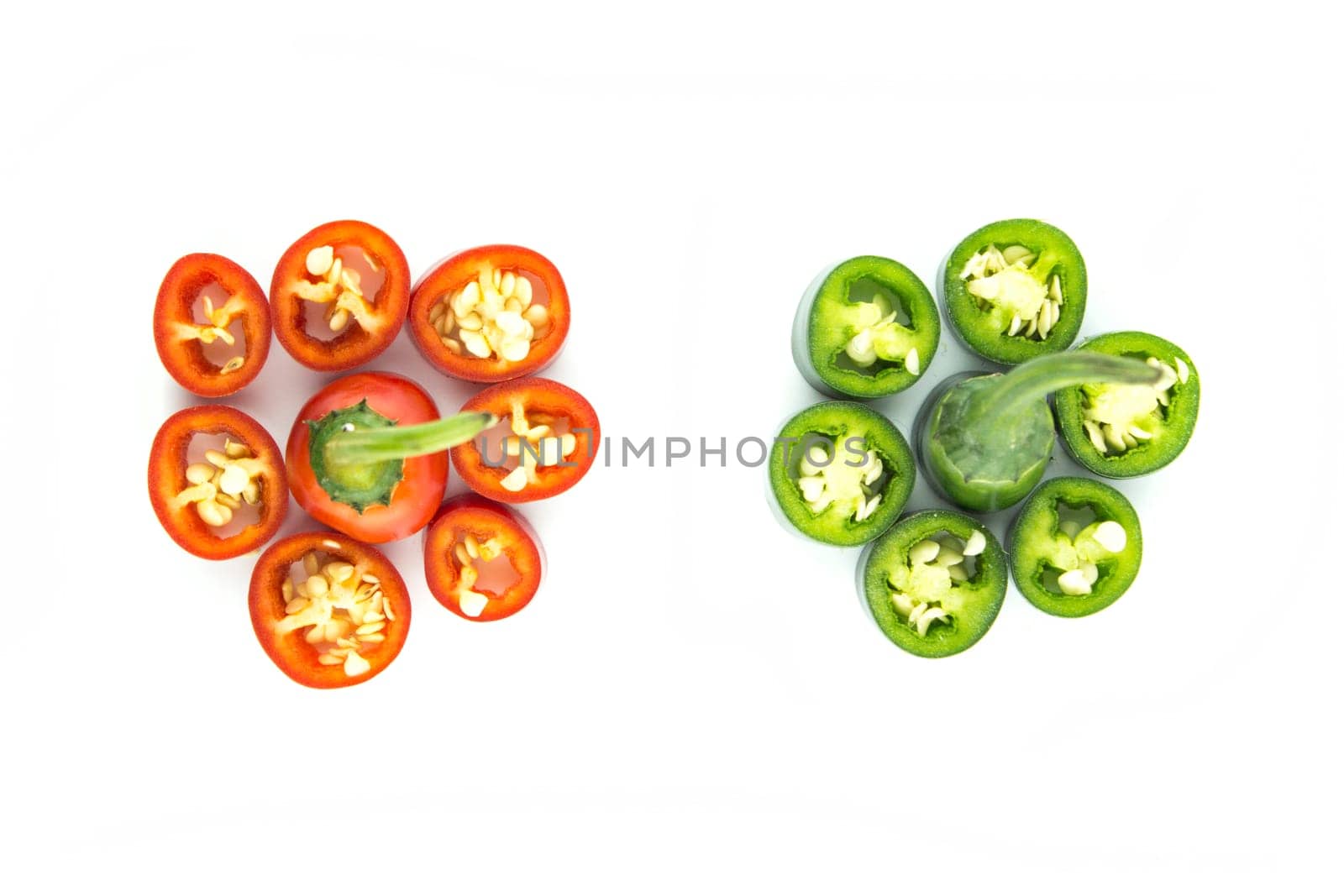 red and green hot chili pepper slices on a white background