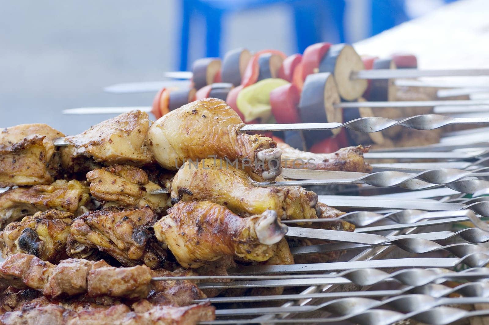 Juicy slices of meat with sauce prepare on fire
