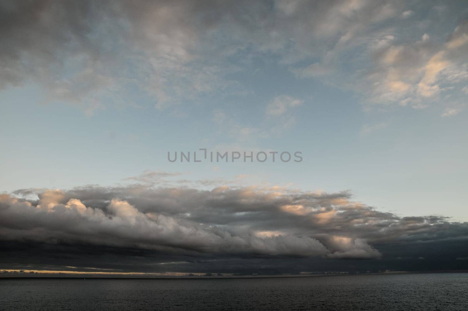 Cloudscape, Colored Clouds at Sunset near the Ocean
