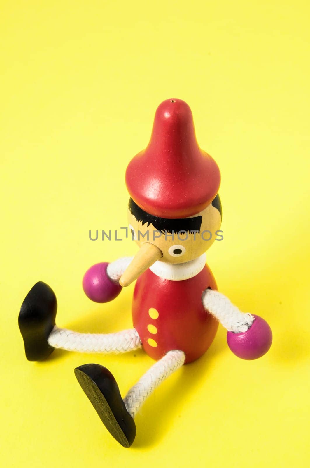 Pinocchio Toy Statue on a Colored Background
