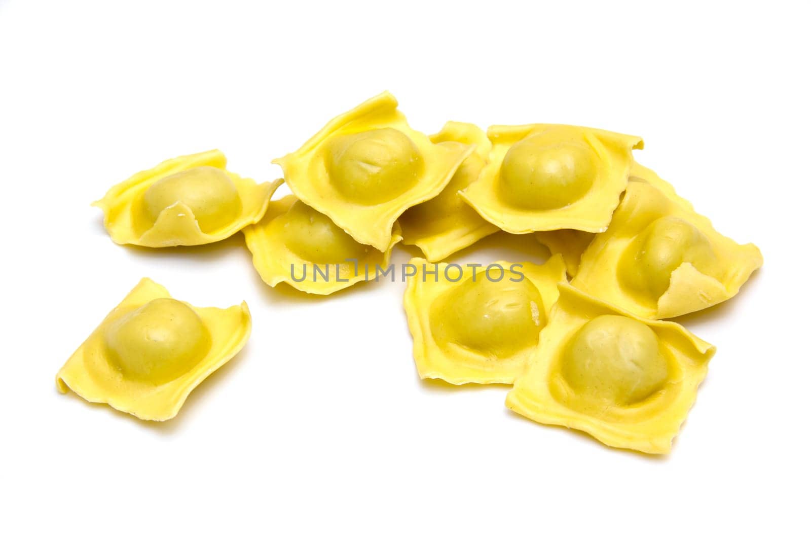 Ravioli arranged on white background