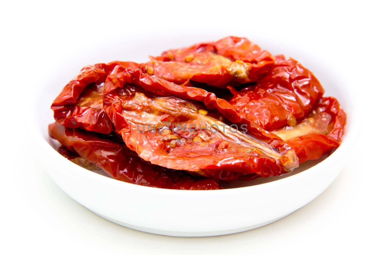 Dried tomatoes on white background