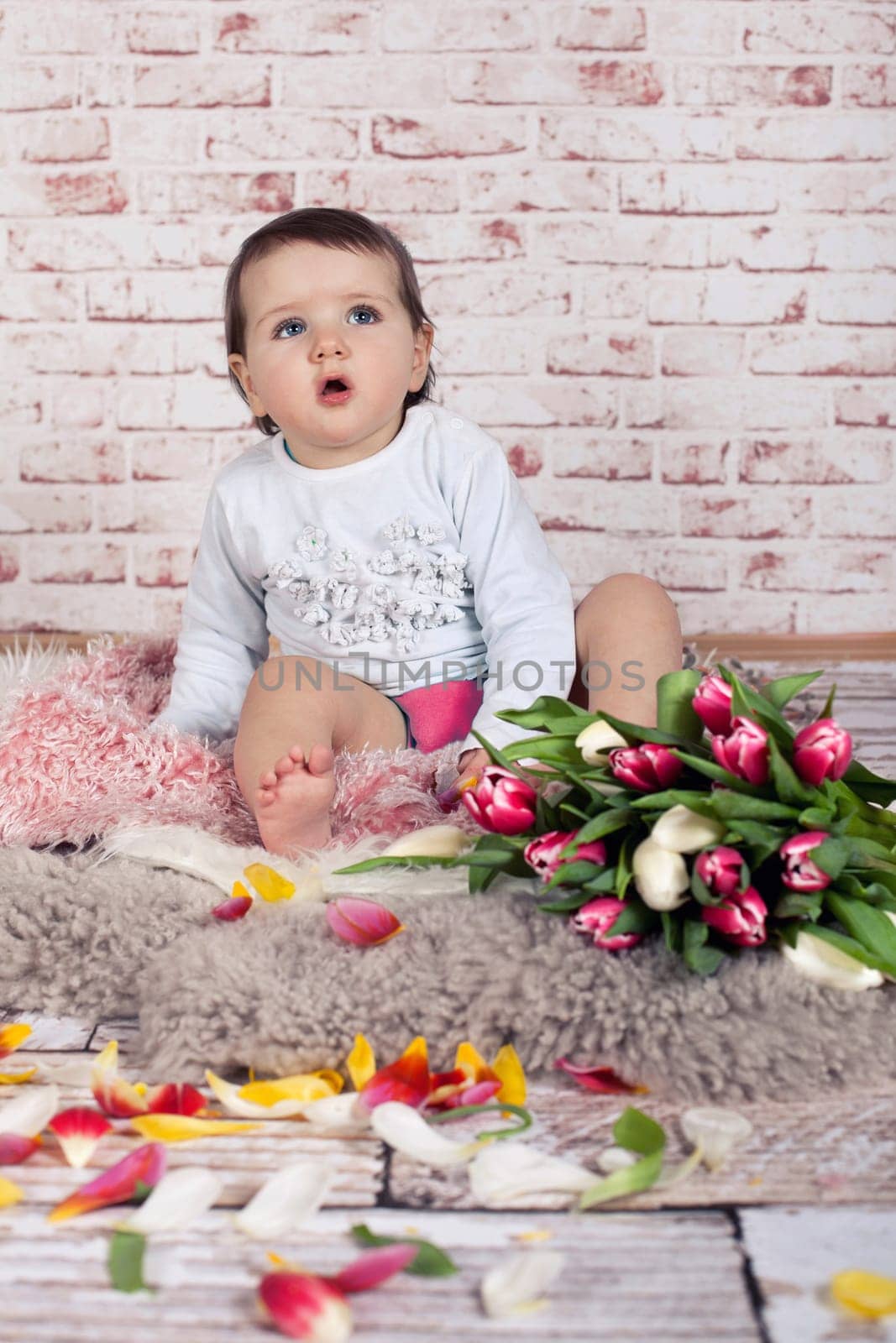 little girl with tulips - surprised