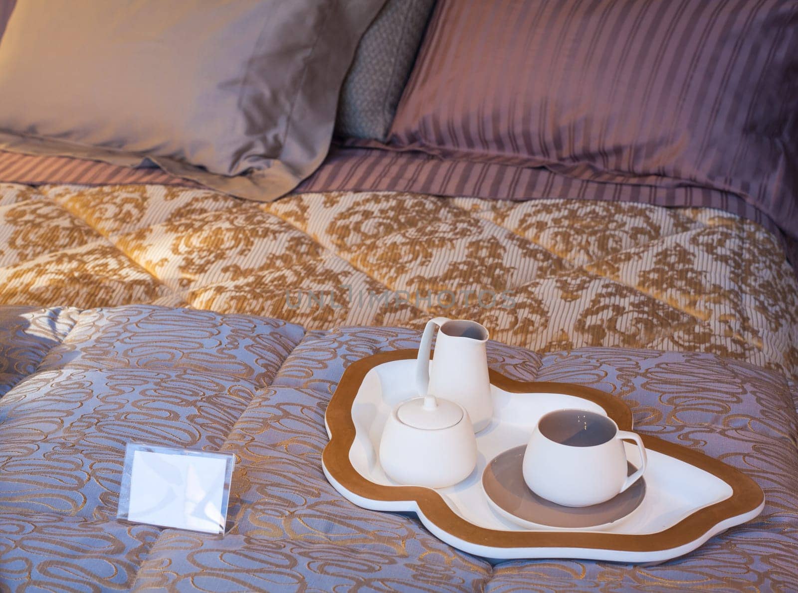 View of Flatware and tray on the bed
