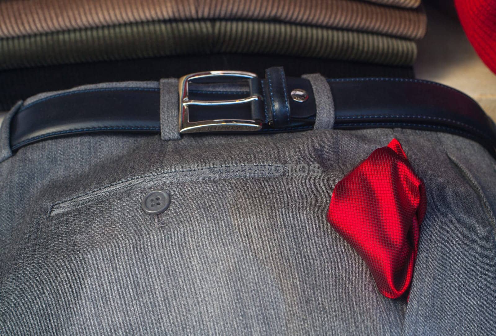 View of red neckerchief on the men's slacks