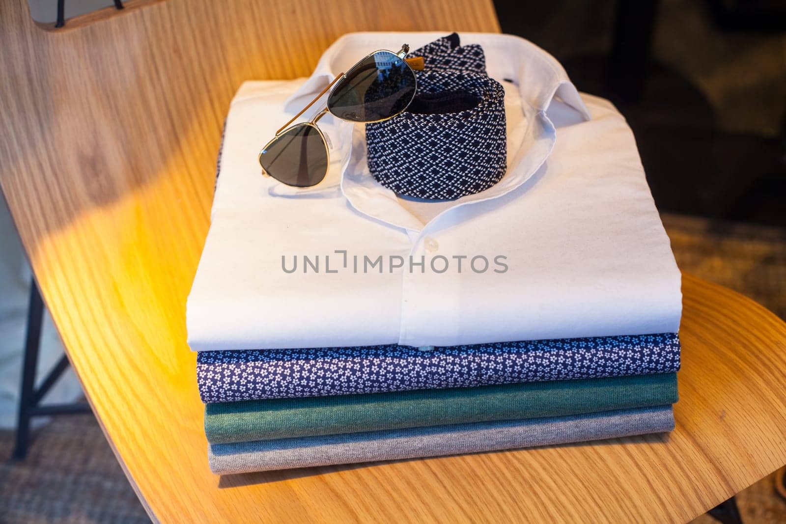 View of men's shirts, necktie and shades