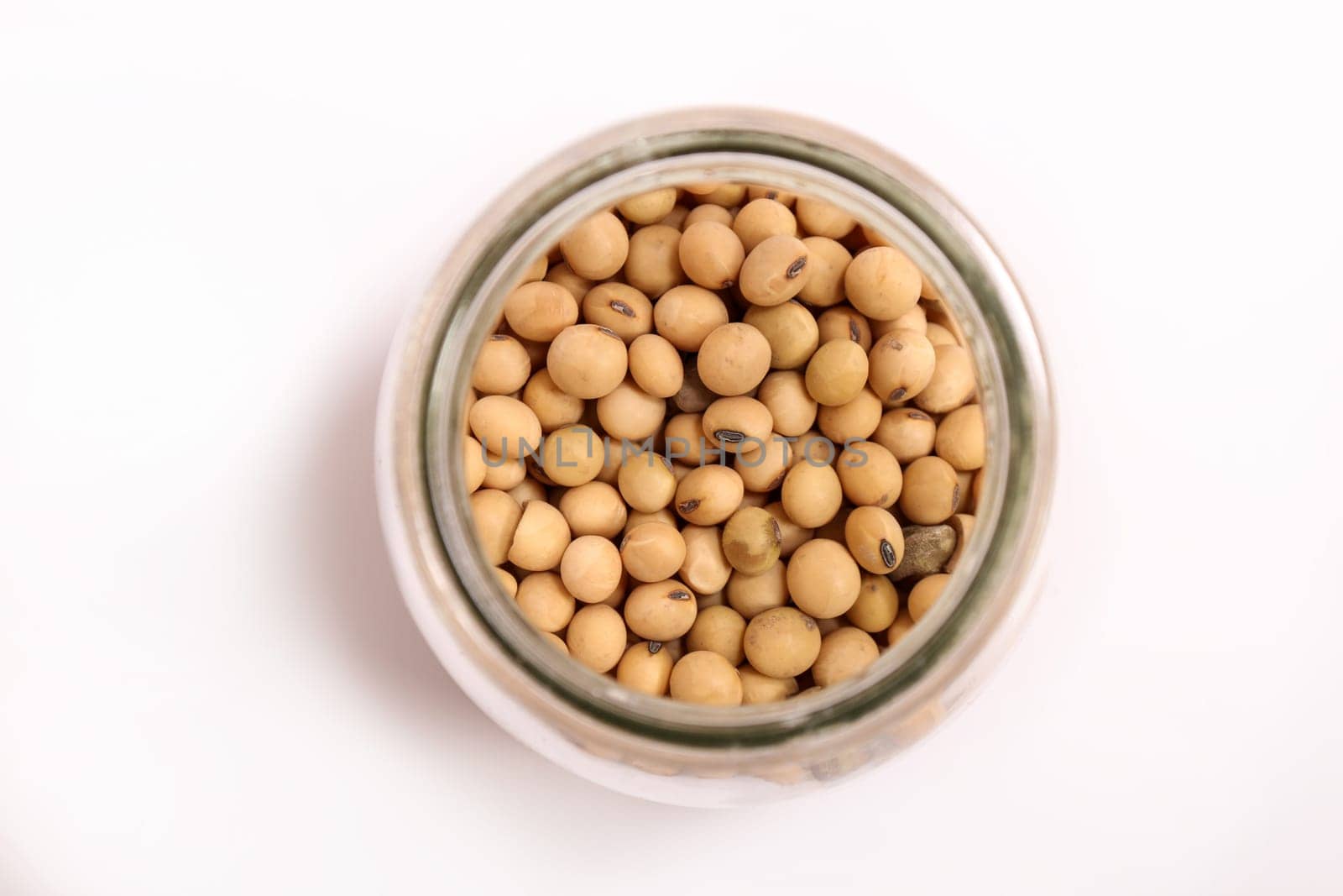 Lots of soybean in a glass pot.