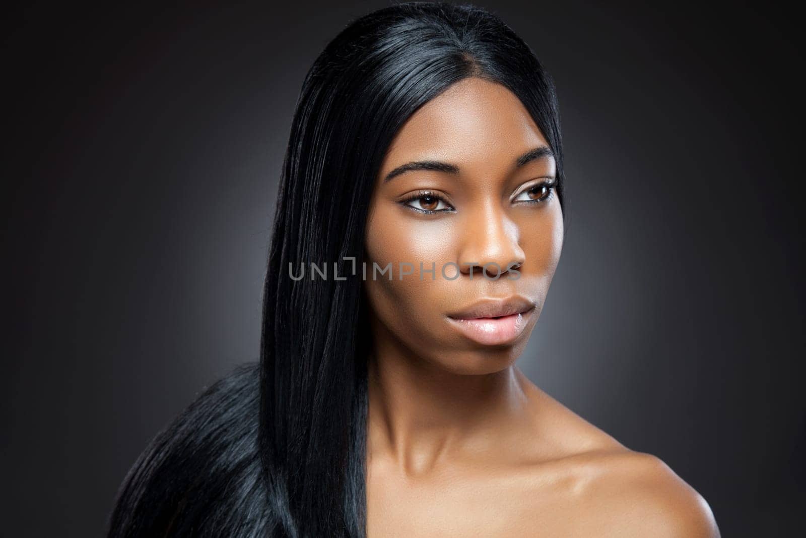 Young black beauty with long straight hair