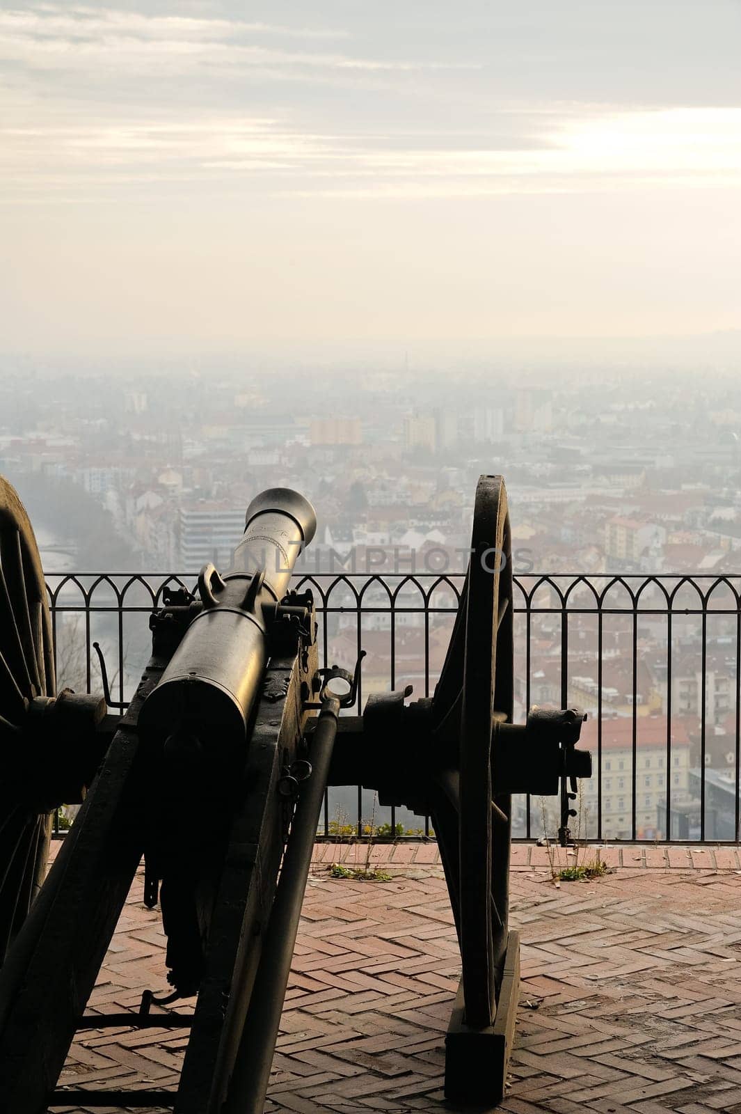 Old cannon on carriage aims at city of Graz