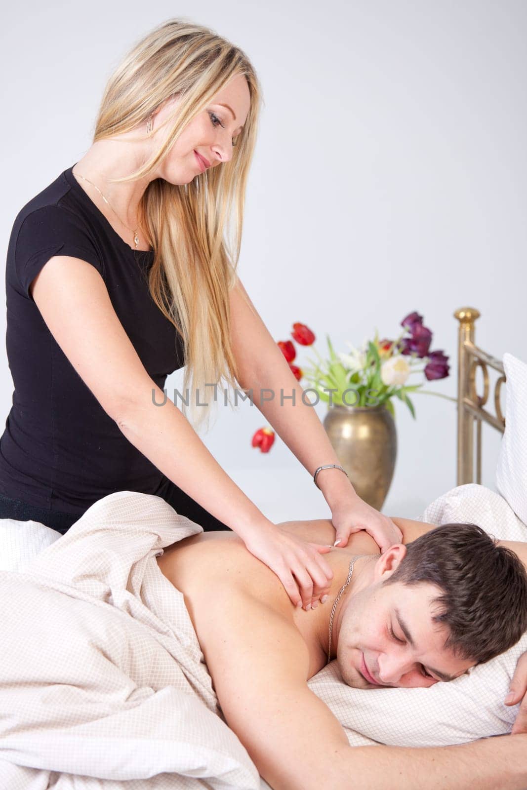 Man receiving relax massage relax treatment from a woman