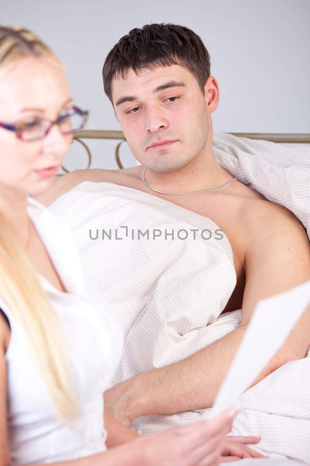 Female doctor explaining report to male patient