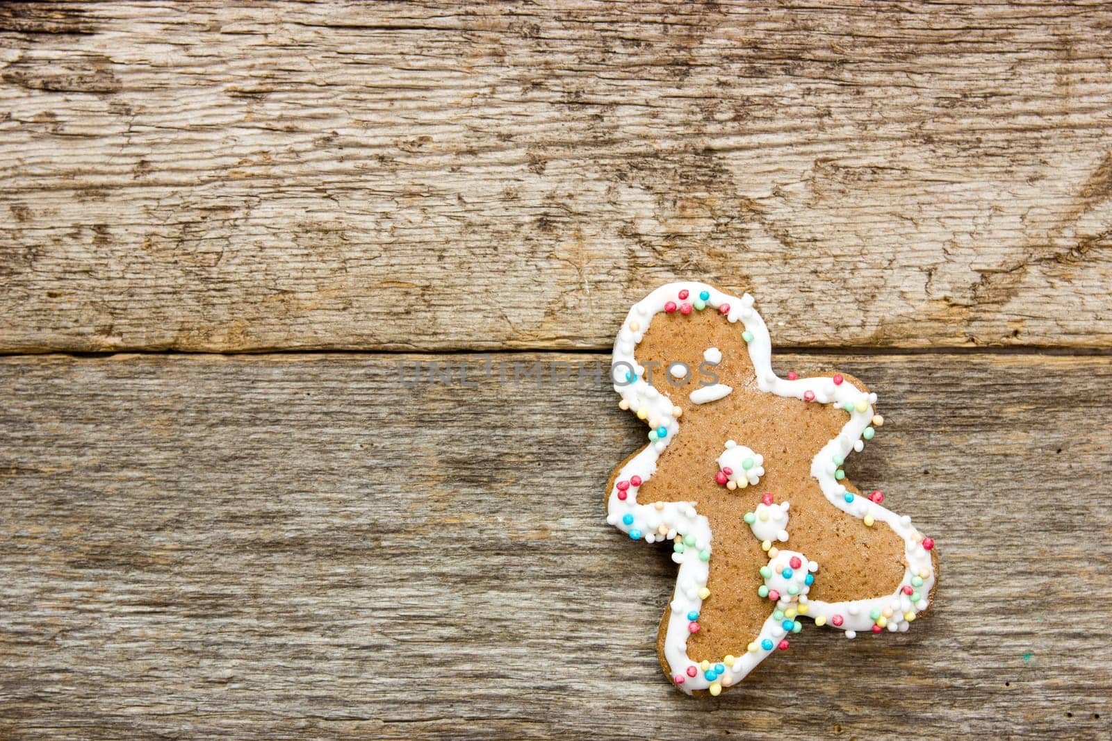 Homemade gingerbread man  on the wooden background